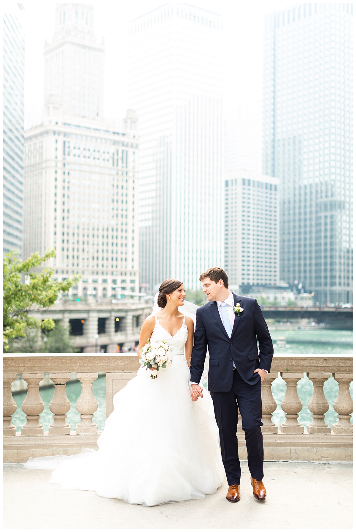 The bride and groom are pictured in their formalwear with downtown Chicago behind them. 
