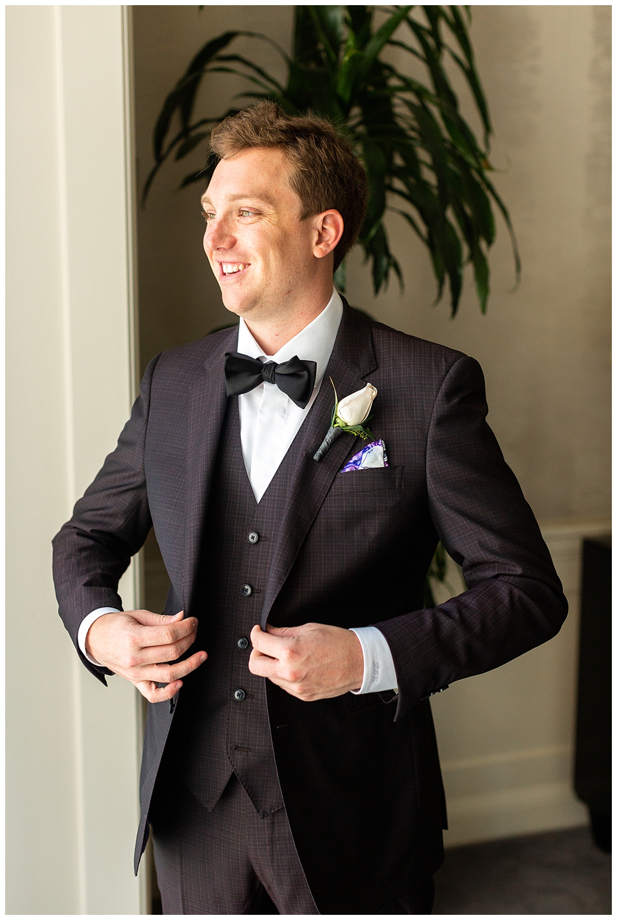 The groom gets ready for his wedding in his custom tux. 