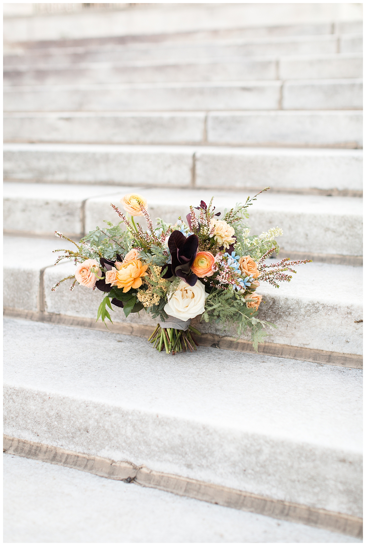 Bride's bouquet displayed on stone steps 