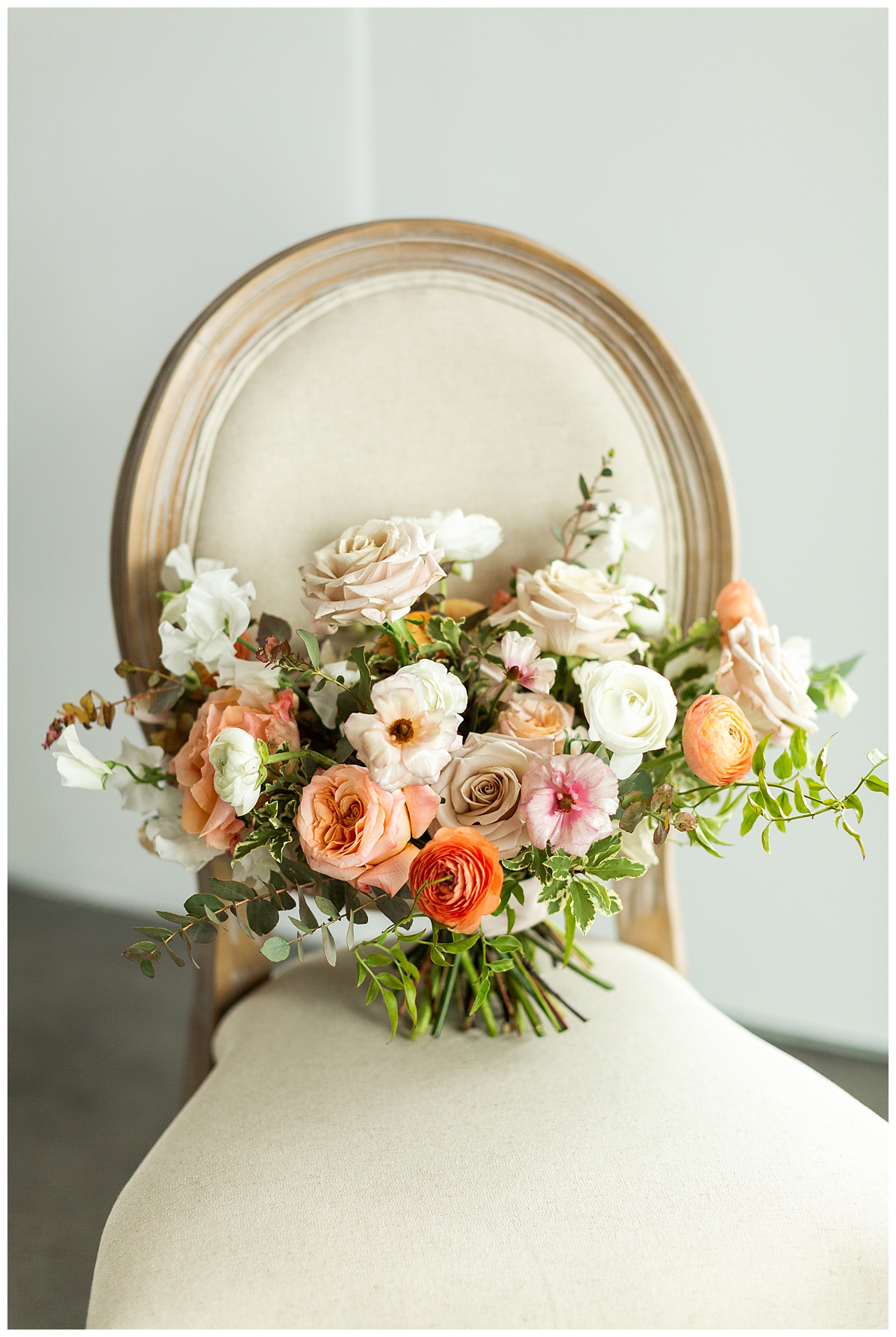 Bride's bouquet displayed on a cream chair