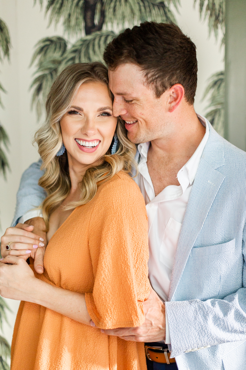 A downtown Charleston engagement session with a couple in summery casual wear. 