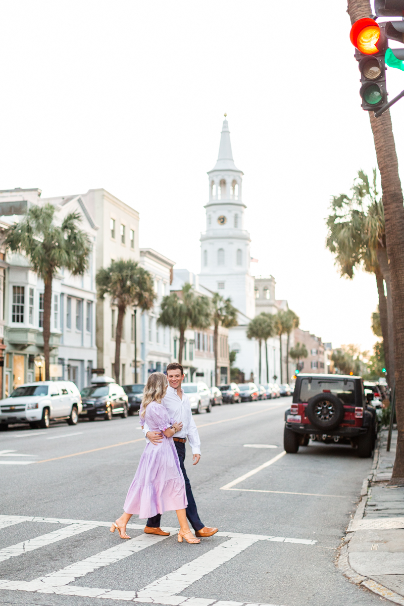 A downtown Charleston engagement session with a couple in summery casual wear. 