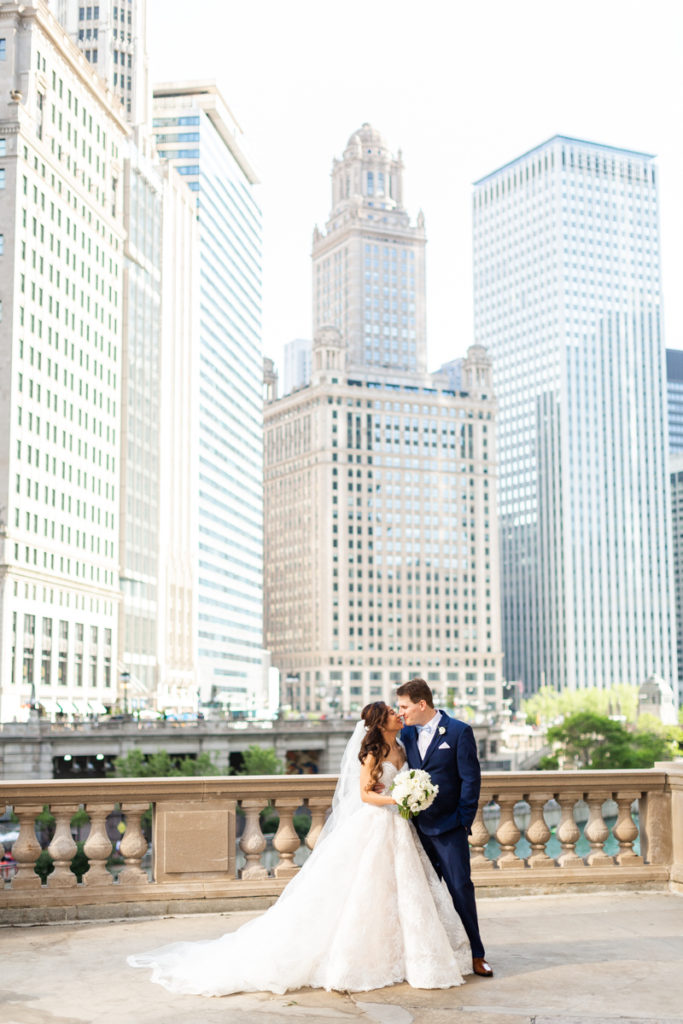 T + J pose for a portrait outside of their reception for their Elegant Romantic Chicago Wedding