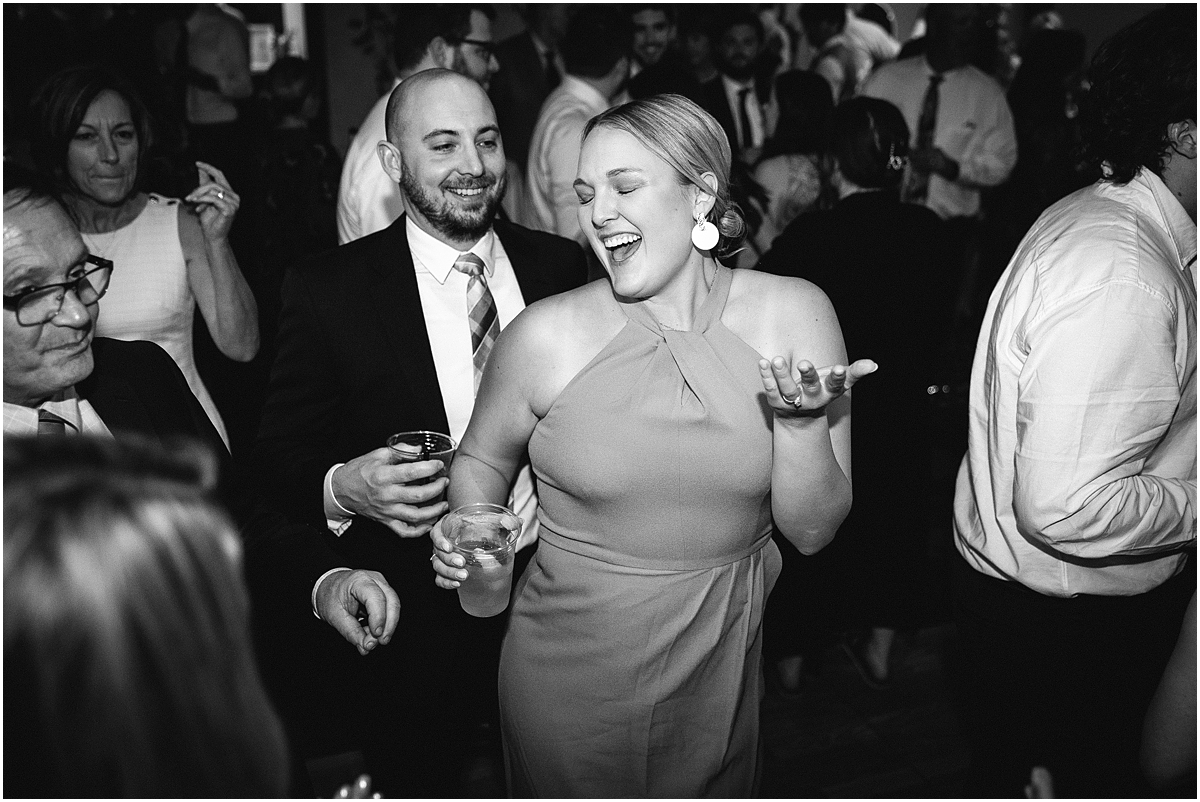 wedding guests dance at Classic and Romantic Wedding at River Forest Country Club 