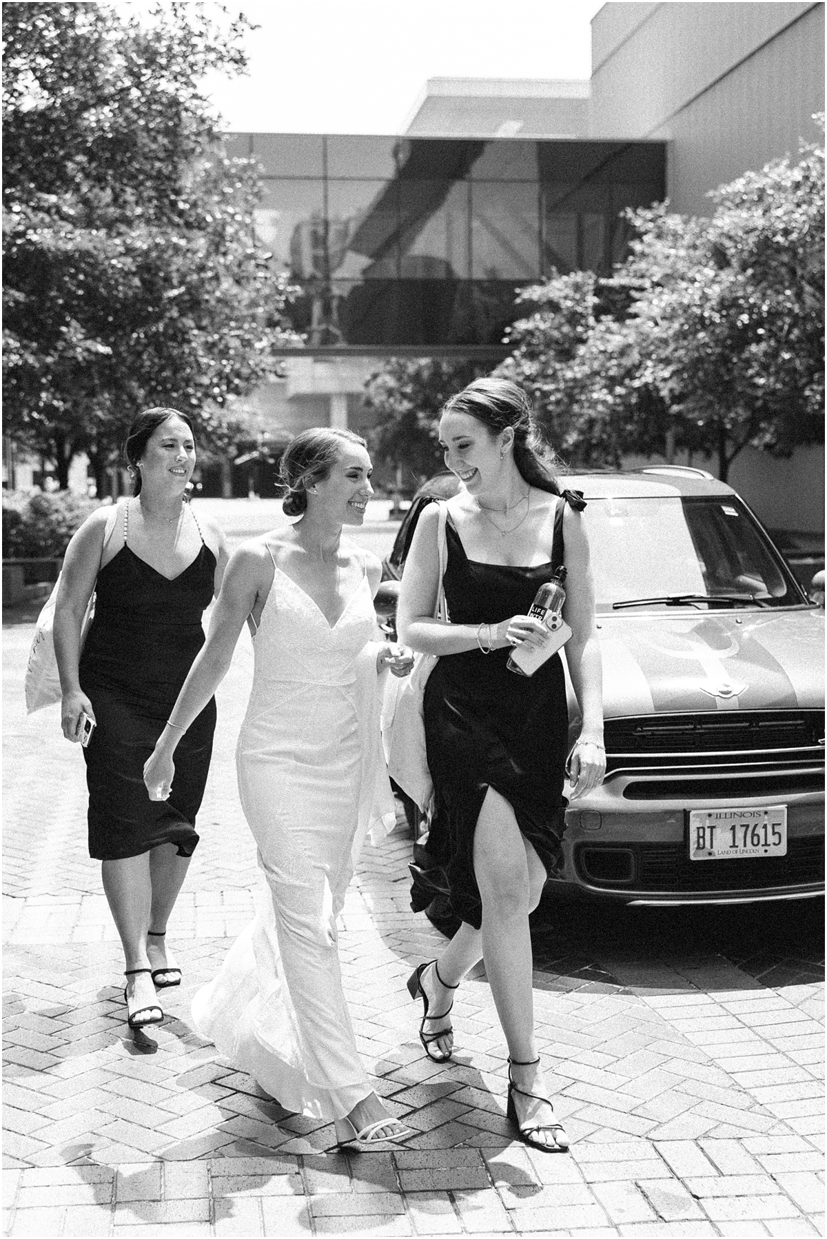 bride walks with bridesmaids 