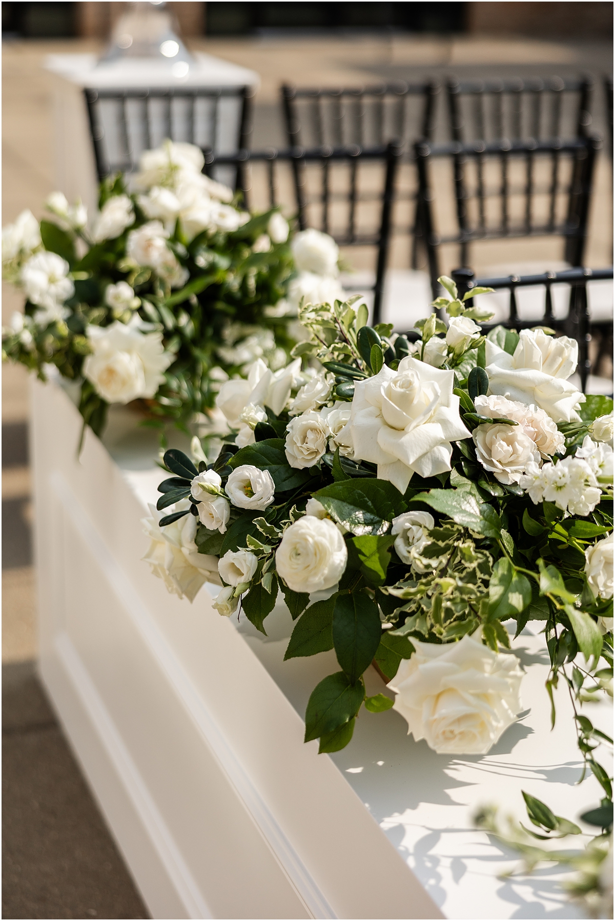 chic and classic wedding flower arrangements from garden inspired wedding ceremony at Revel Motor Row