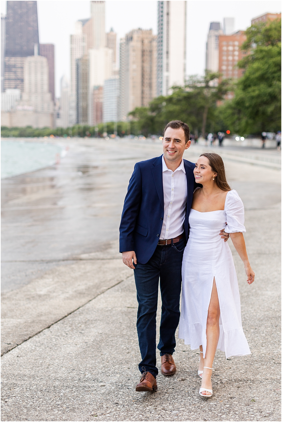 couple walk down North Avenue Beach in Chicago