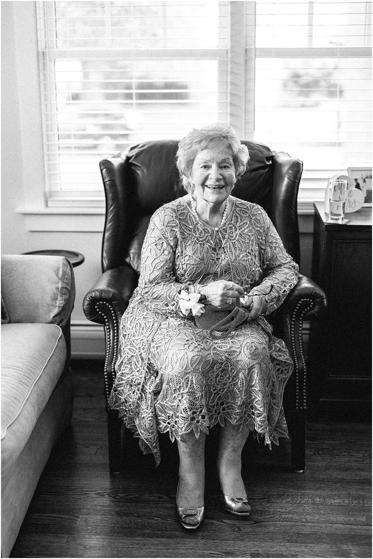 grandma sits in chair waiting to see the bride