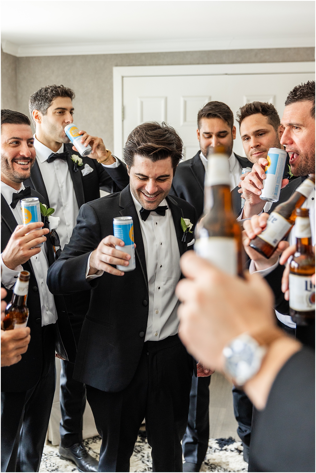 groom and groomsmen, including Las Vegas Raiders Quarterback, Jimmy Garoppolo, share a drink before wedding 