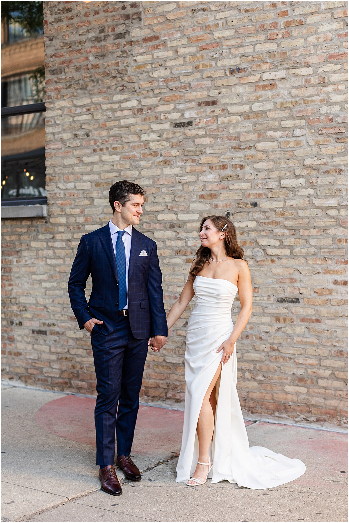 newlywed portraits of couple holding hands