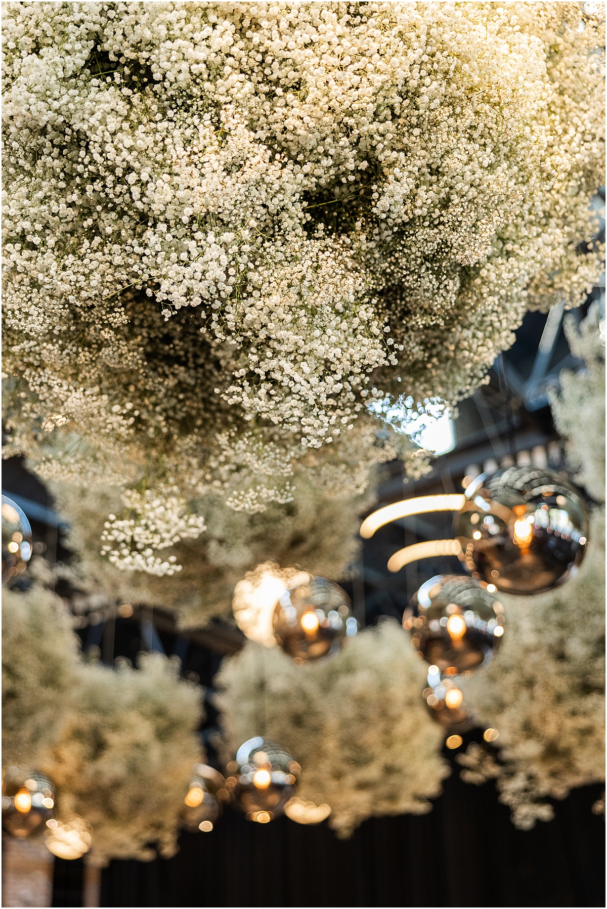 white flowers suspended from ceiling at Chicago wedding at City Hall Chicago Events