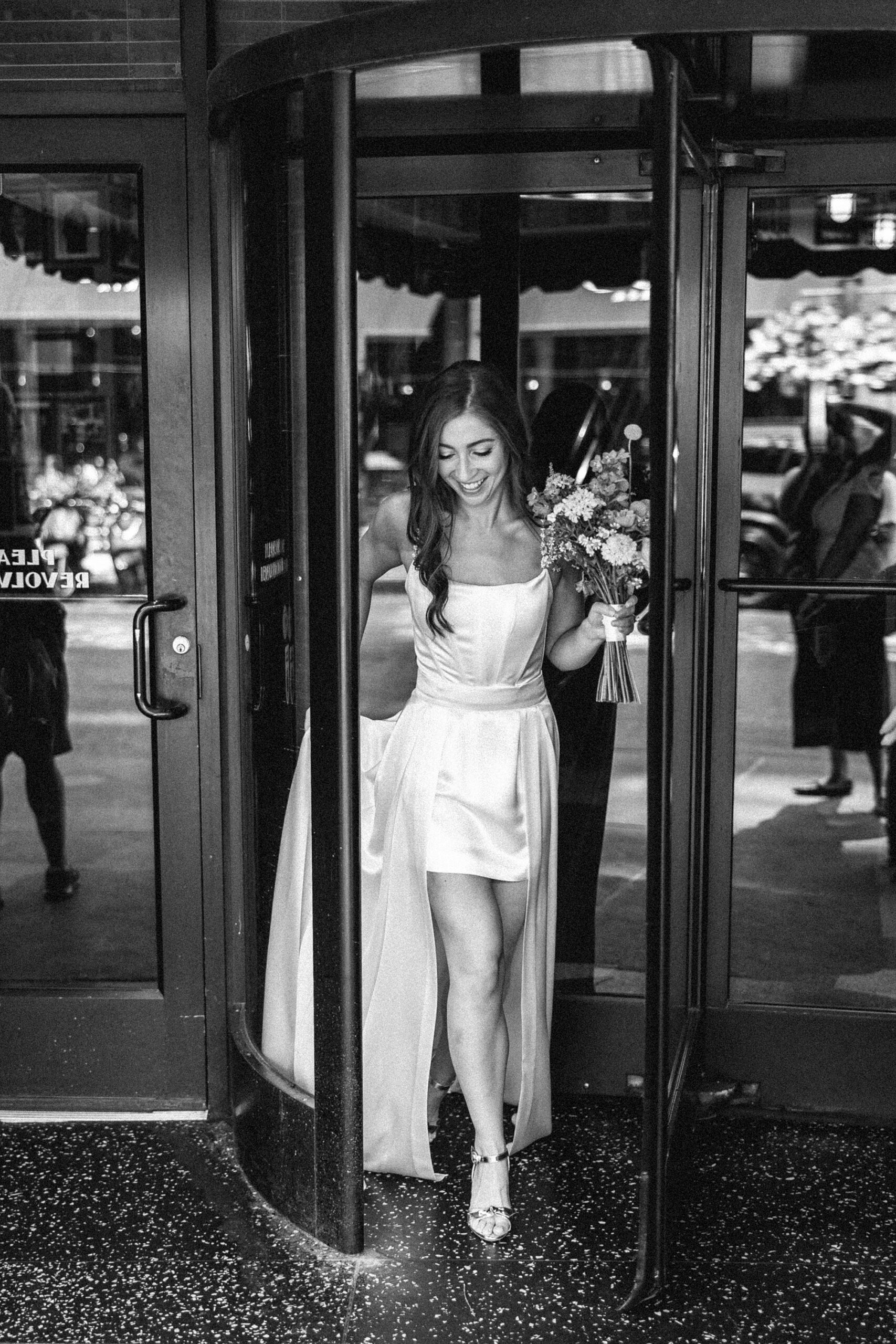 bride walking out of building in Chicago