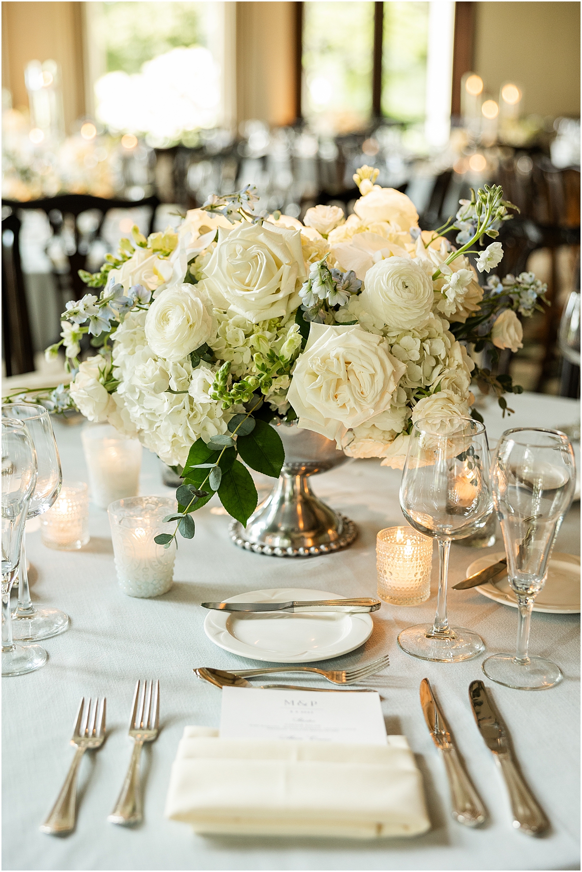classic white flower centerpieces and elegant tablescape at Sunset Ridge Wedding