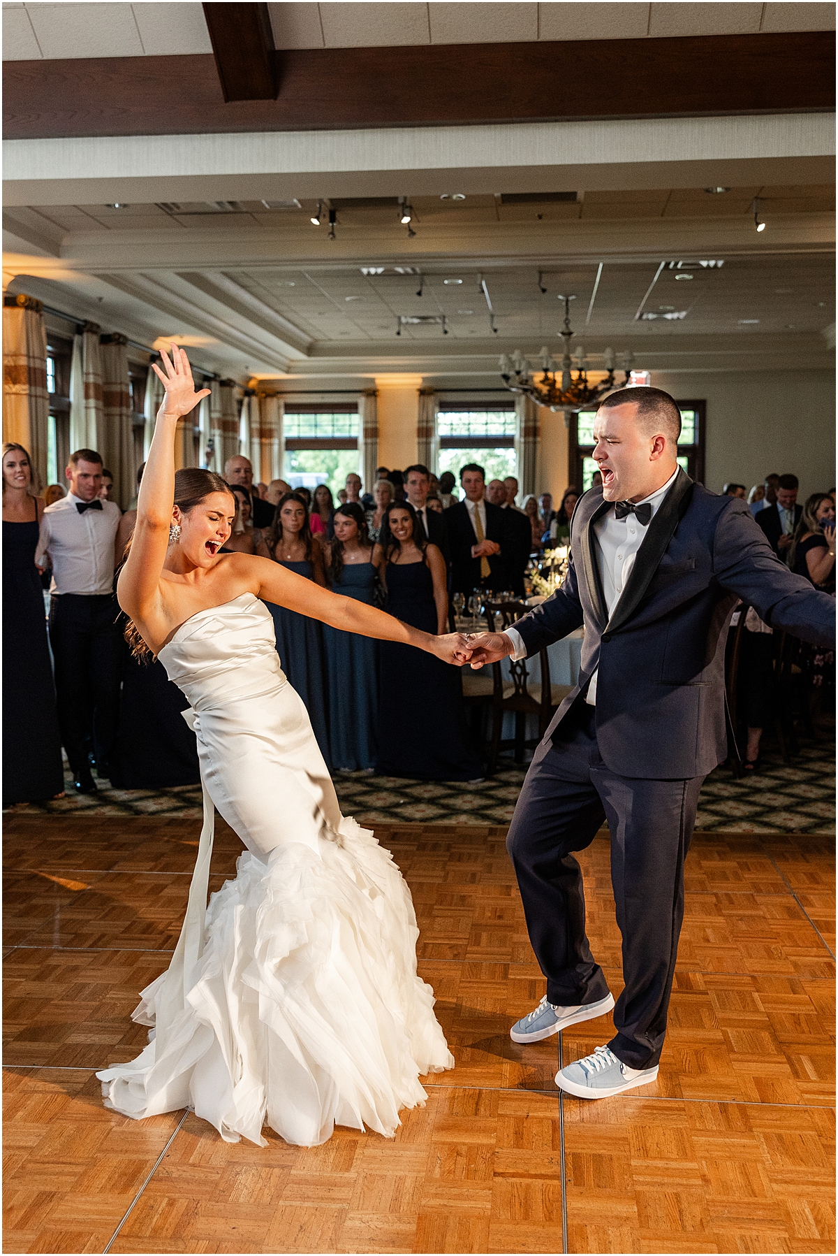 bride and groom share a fun first dance 