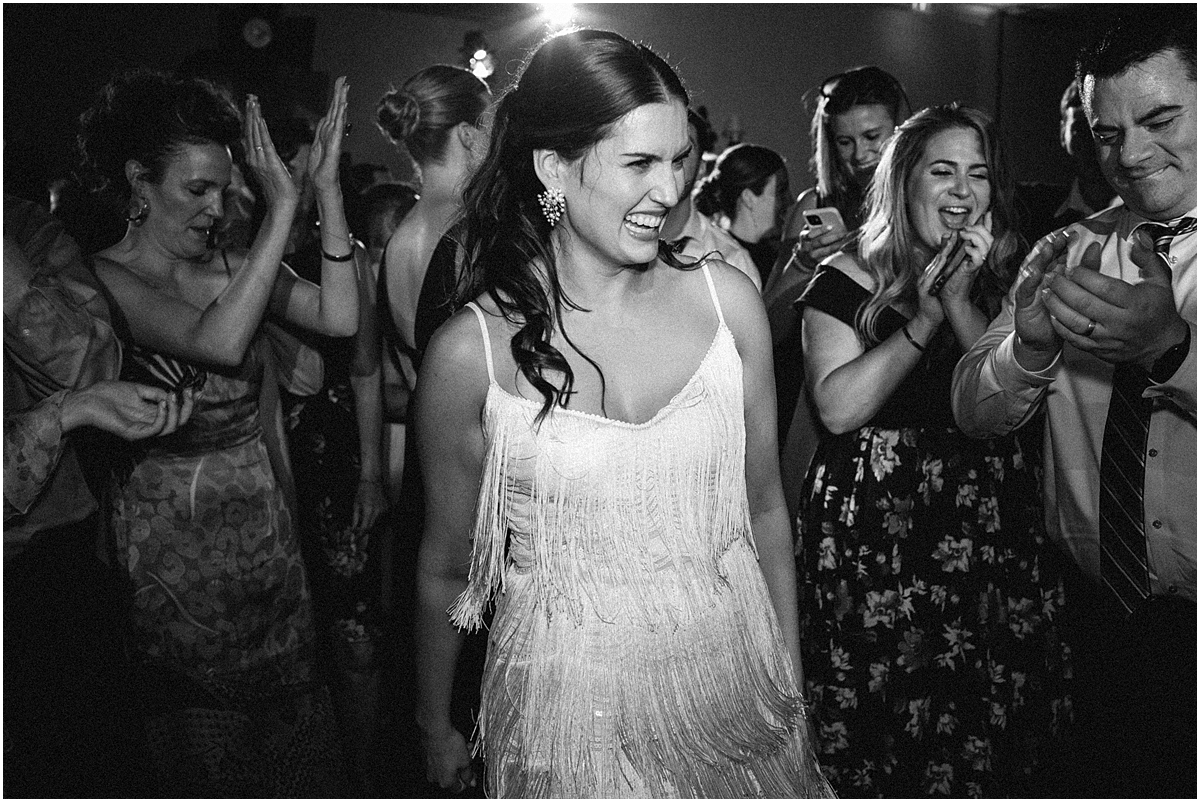 candid photo of bride on dance floor