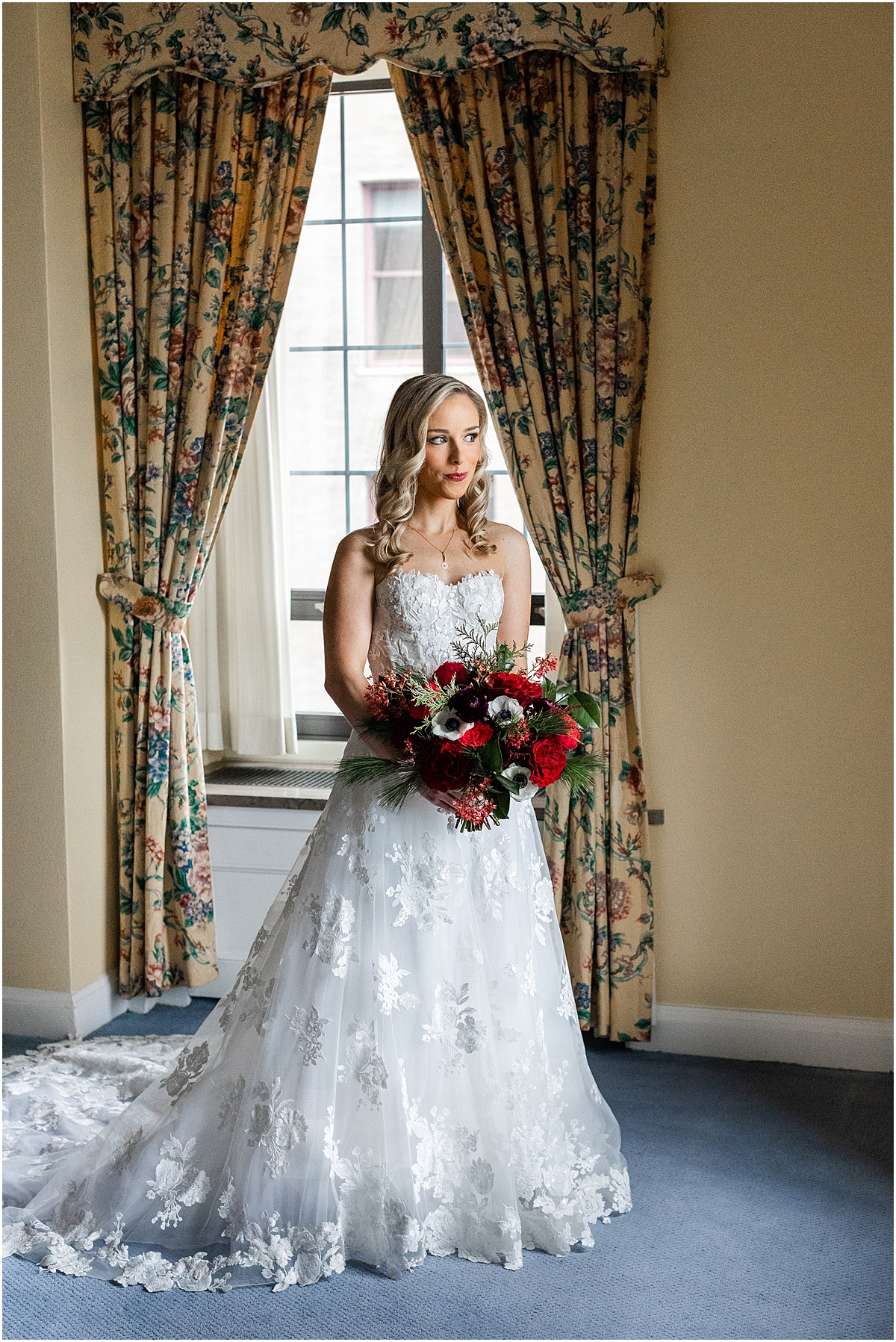 bridal portraits holding festive Christmas inspired bouquet