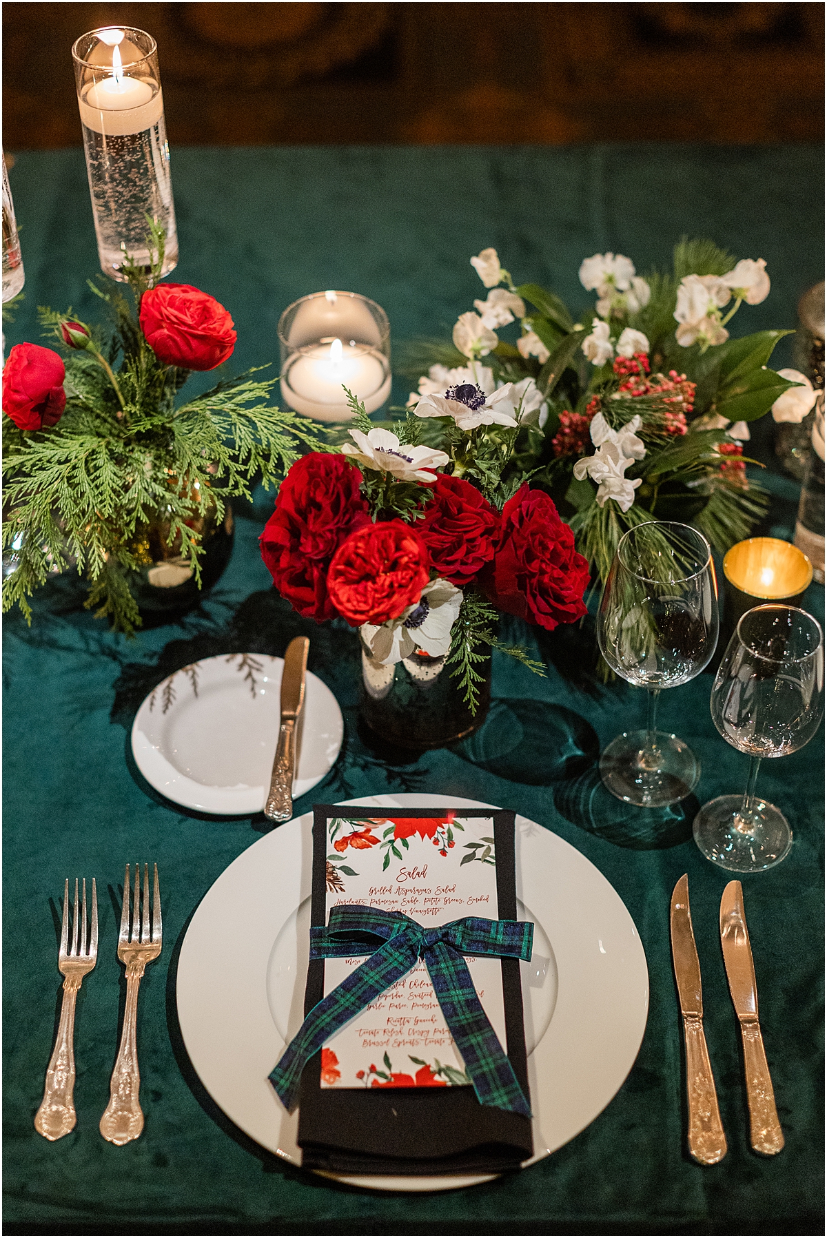 red and white flowers with green plaid details at table place setting 
