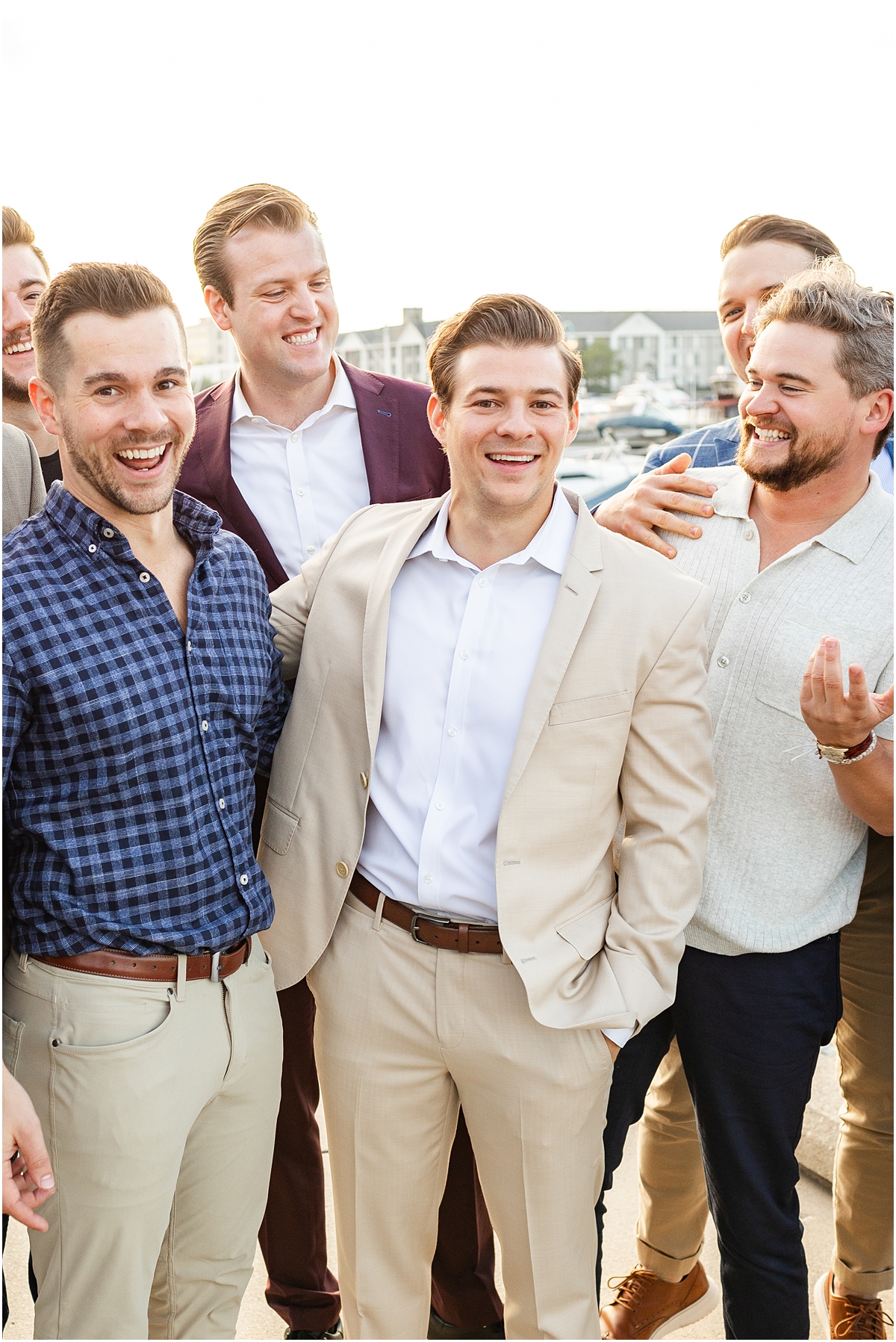 groom with friends as rehearsal dinner