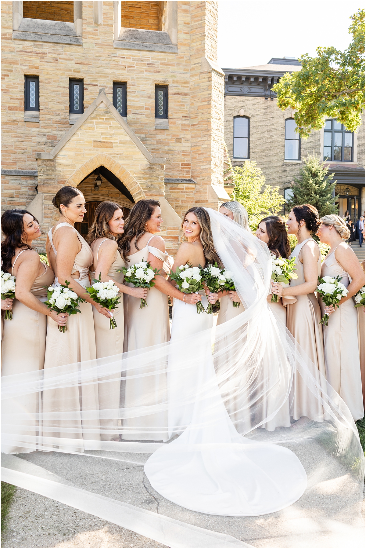 bride and bridesmaids in champagne colored bridesmaids dresses