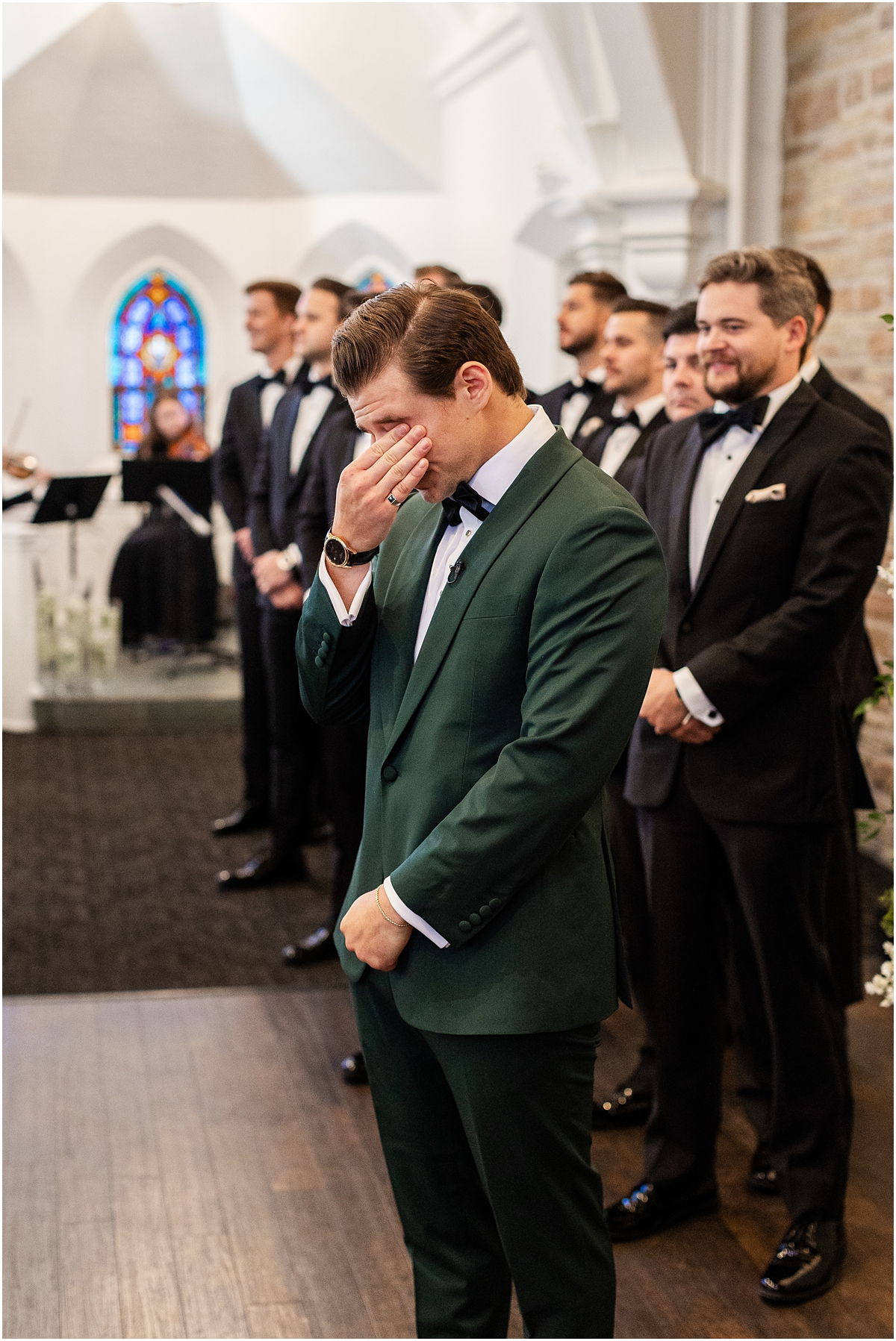 emotional groom as bride walks down the aisle 