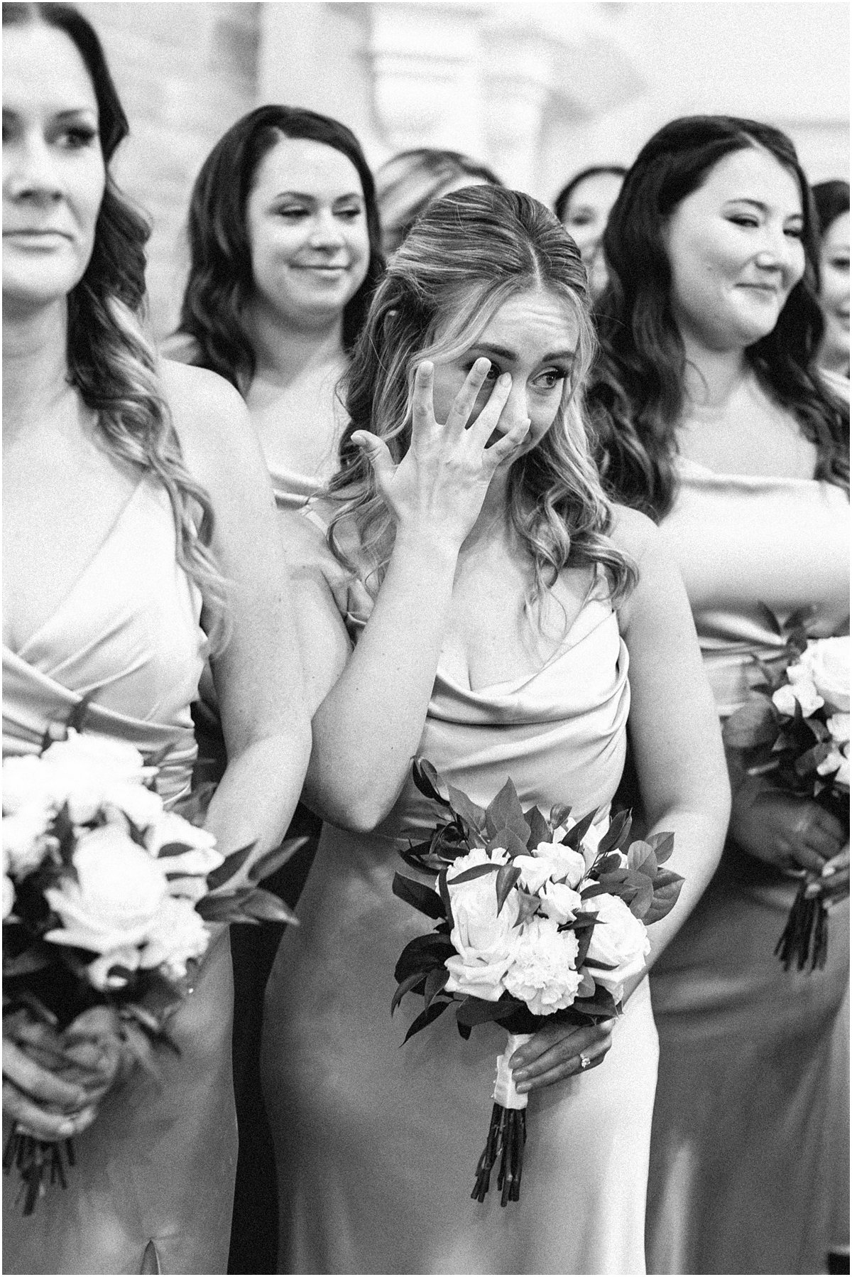 bridesmaid wipes away tears