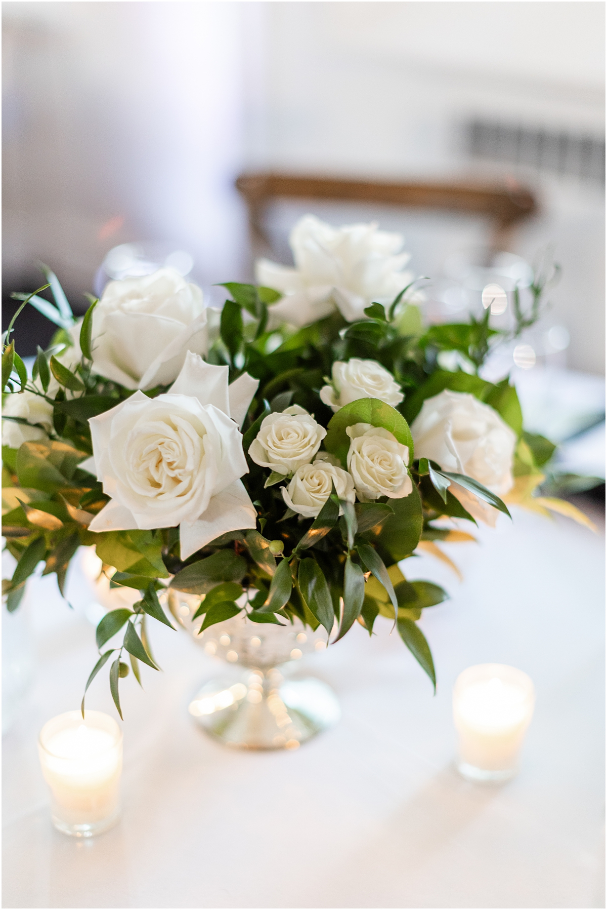 white rose floral centerpieces from The Covenant At Murray Mansion Wedding