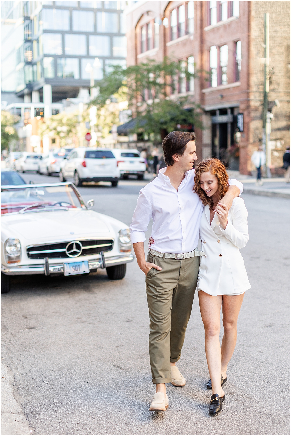 couple walk through West Loop neighborhood during Chicago Engagement Session