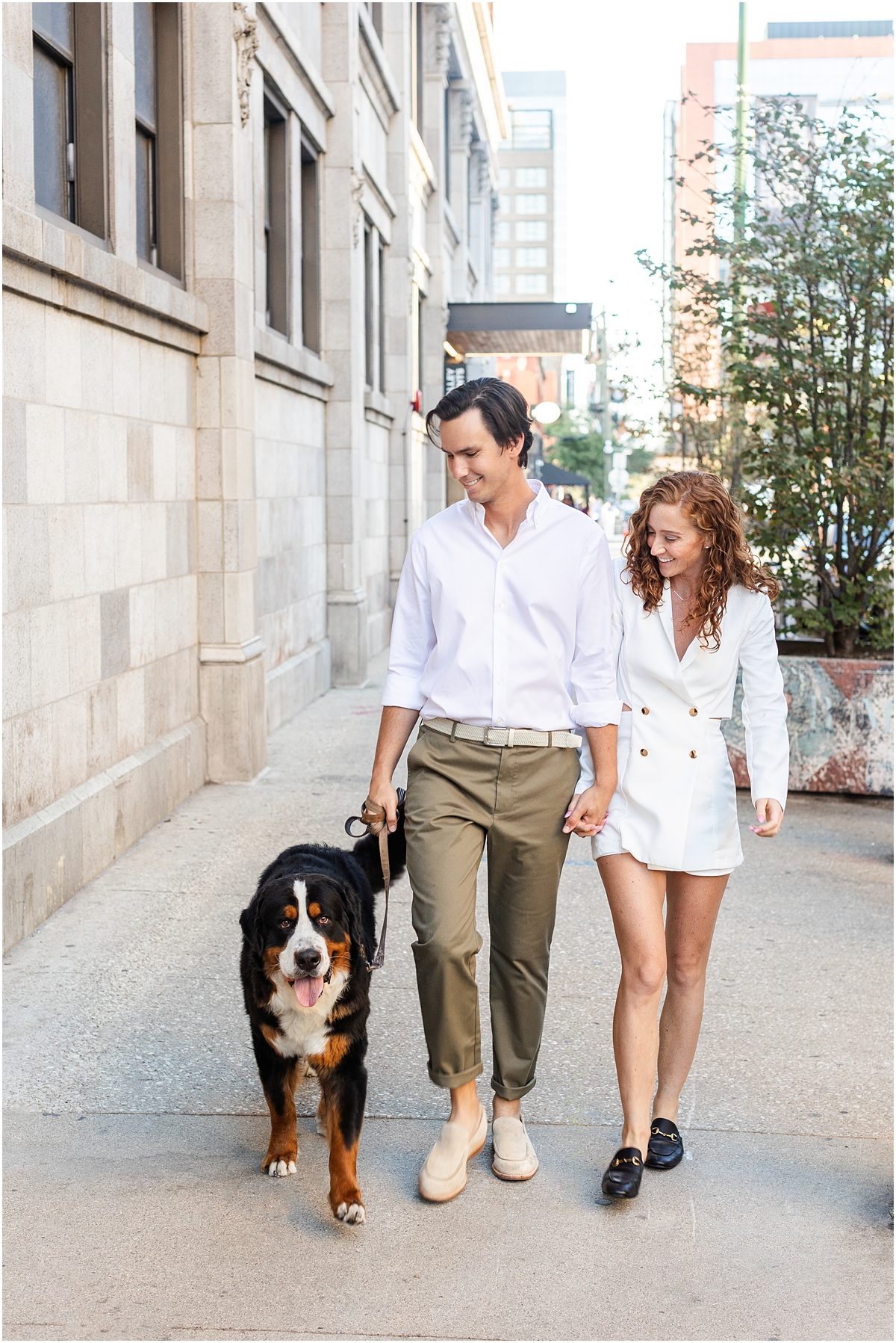 couple walk with their dog during West Loop and North Avenue Engagement Session