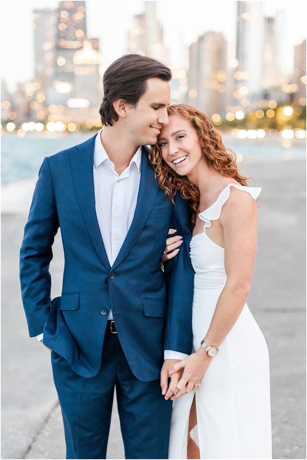 engagement portraits at North Avenue beach with Chicago Skyline in the background