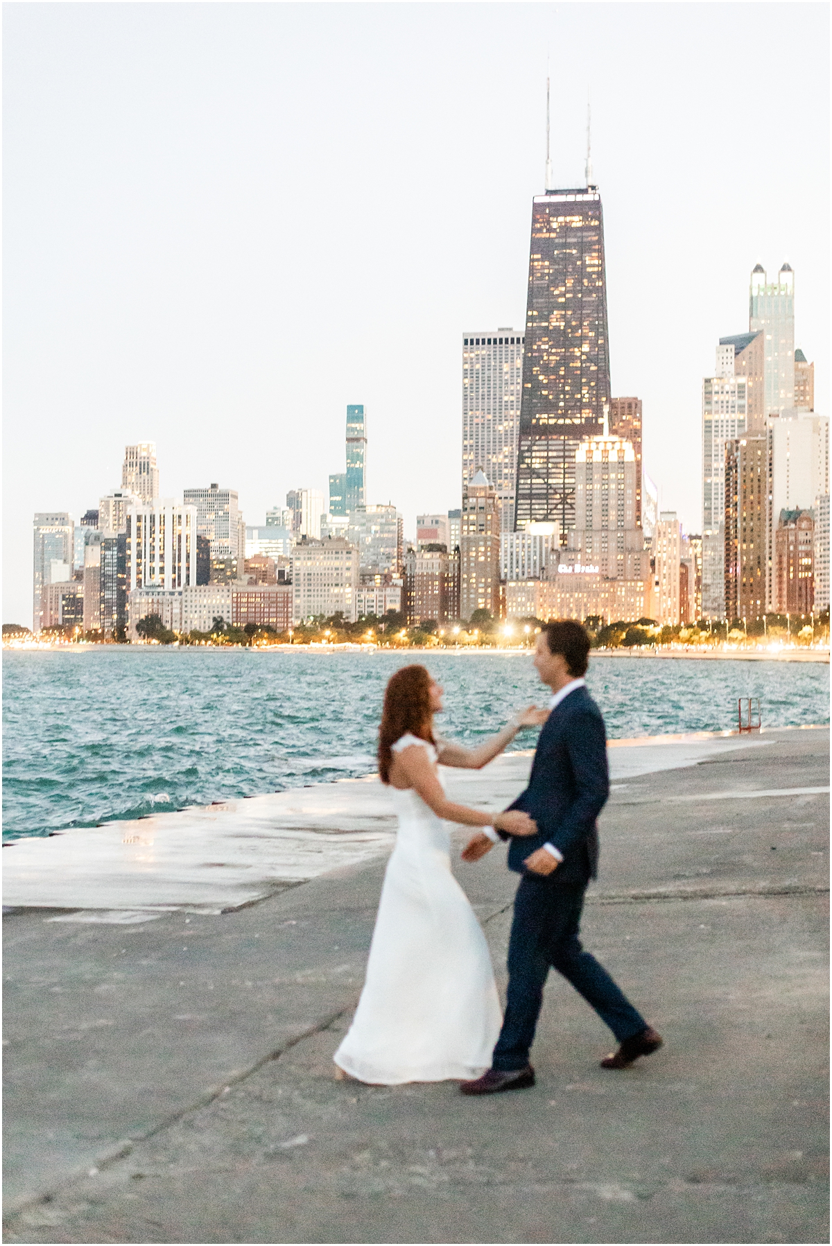 Chicago skyline at North Avenue Beach engagement session