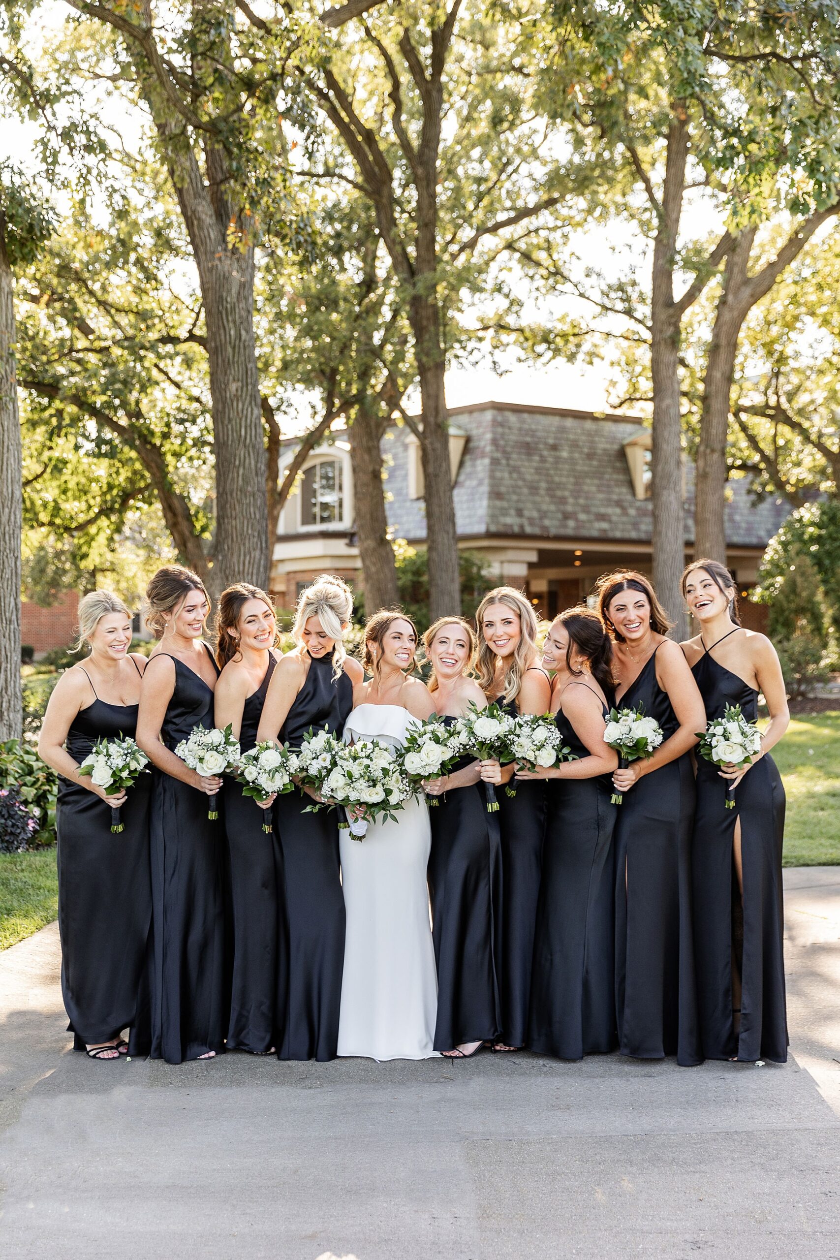 classic bridal party portraits of bridesmaids in black dresses