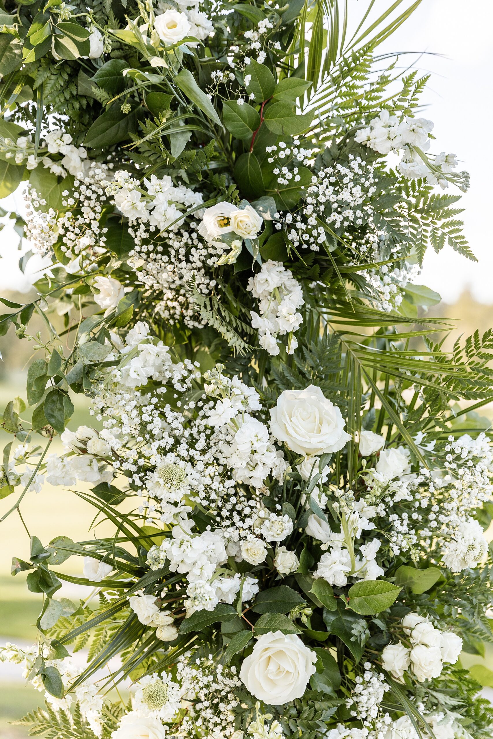 white wedding flower arrangements from wedding ceremony at Butterfield Country Club  