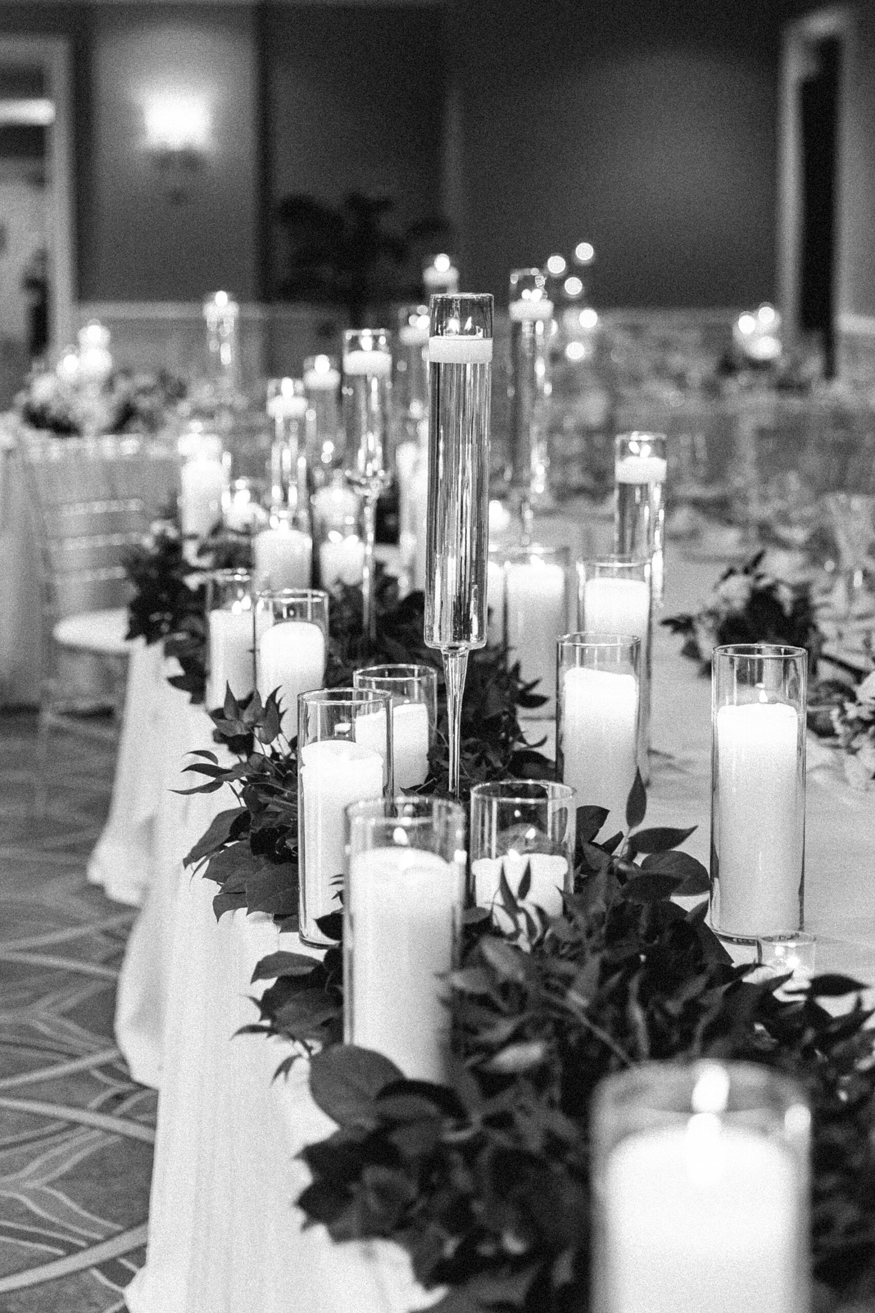 flickering candles decorate wedding reception at Butterfield Country Club