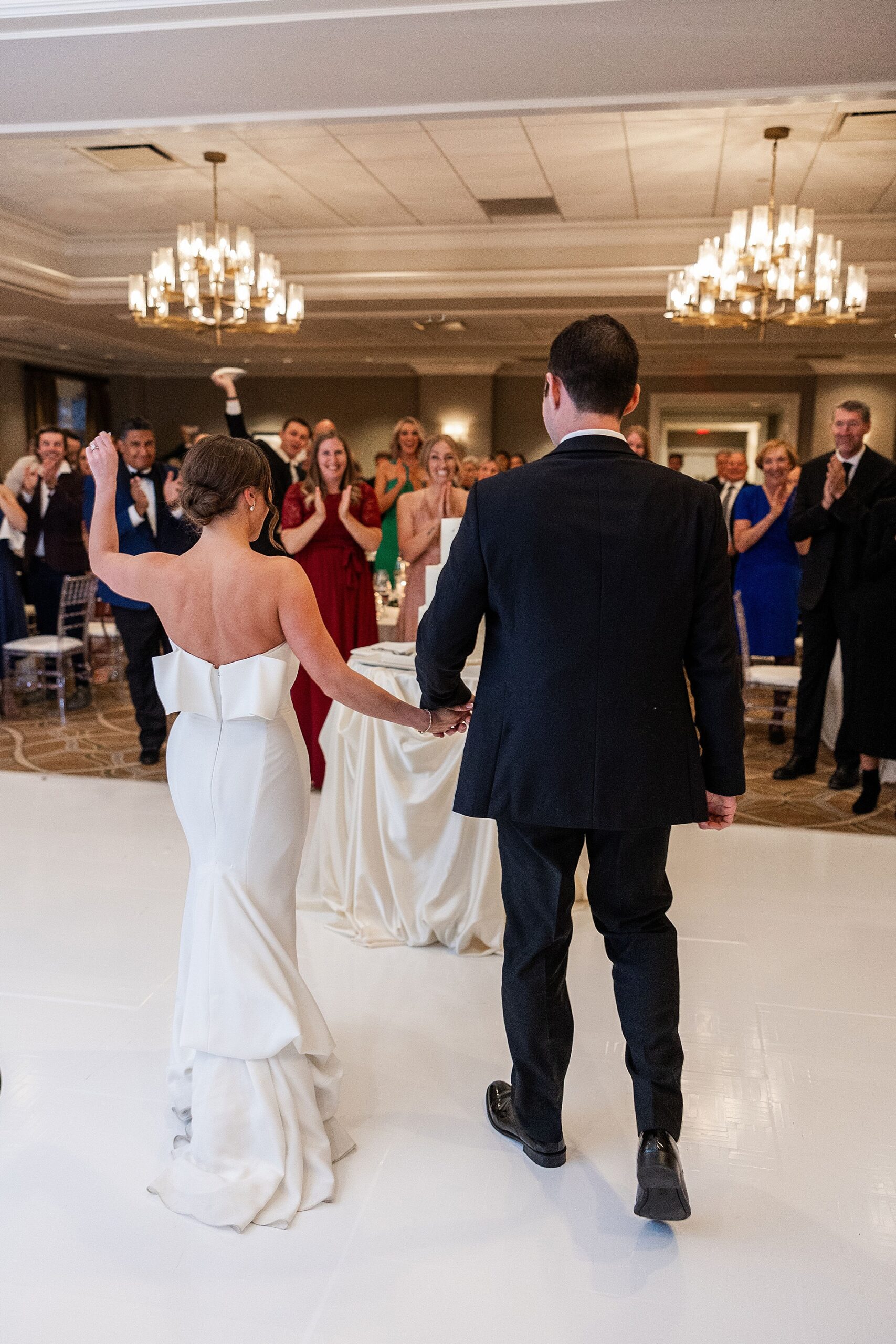 newlyweds enter wedding reception together 