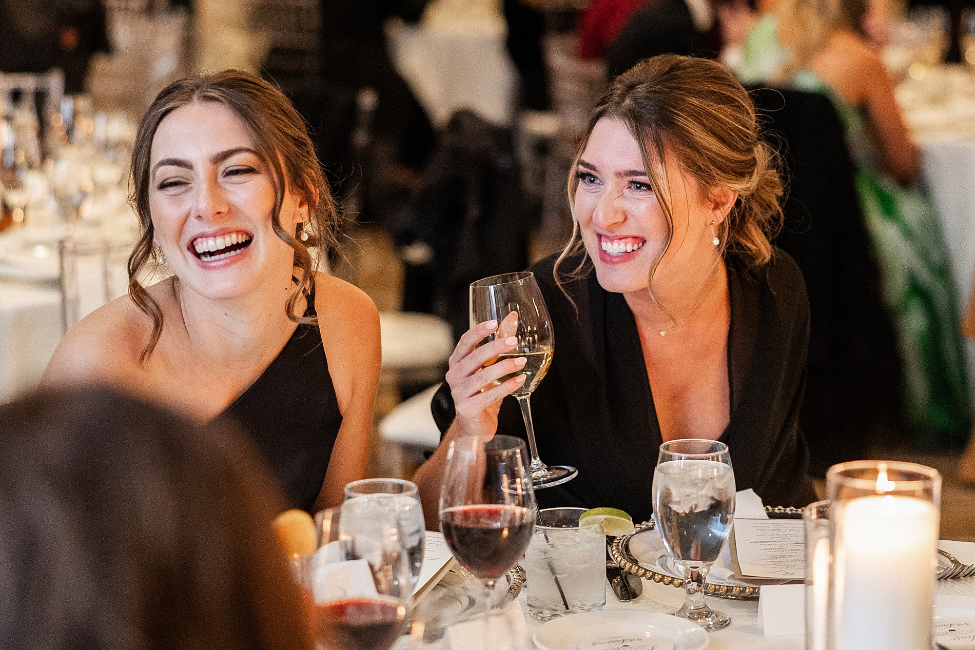 wedding guests laugh during wedding toasts