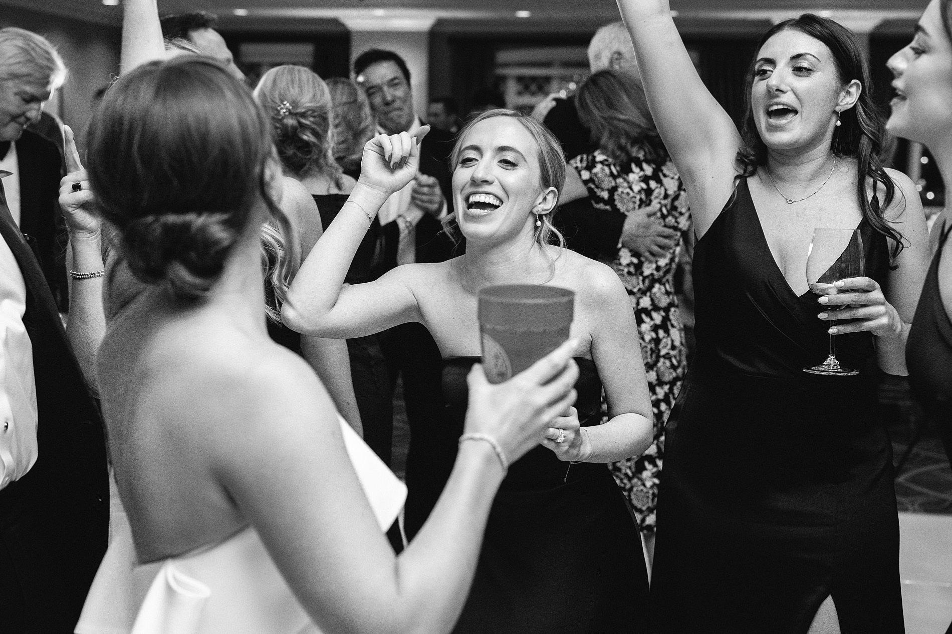 bride and bridesmaids on the dance floor