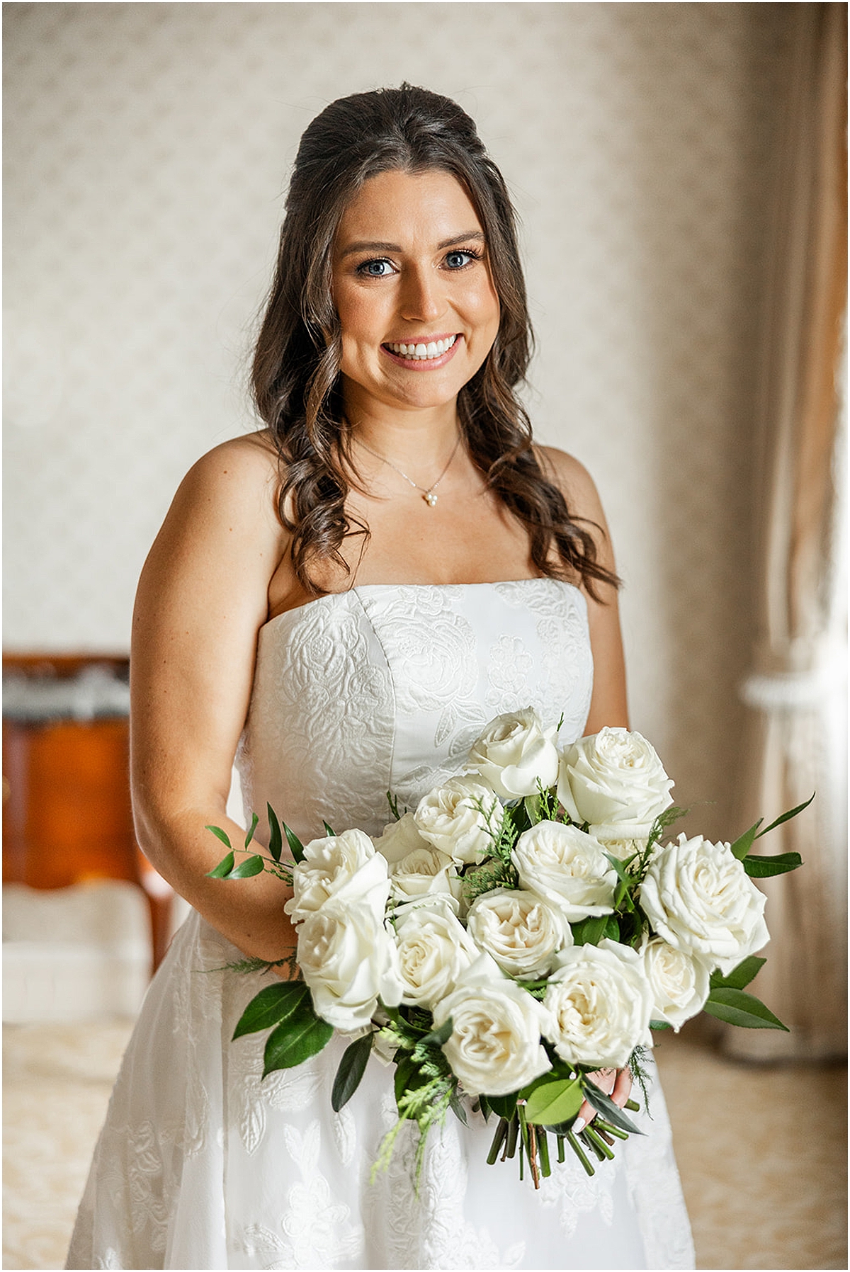 elegant bridal portraits of bride holding white rose bouquet 