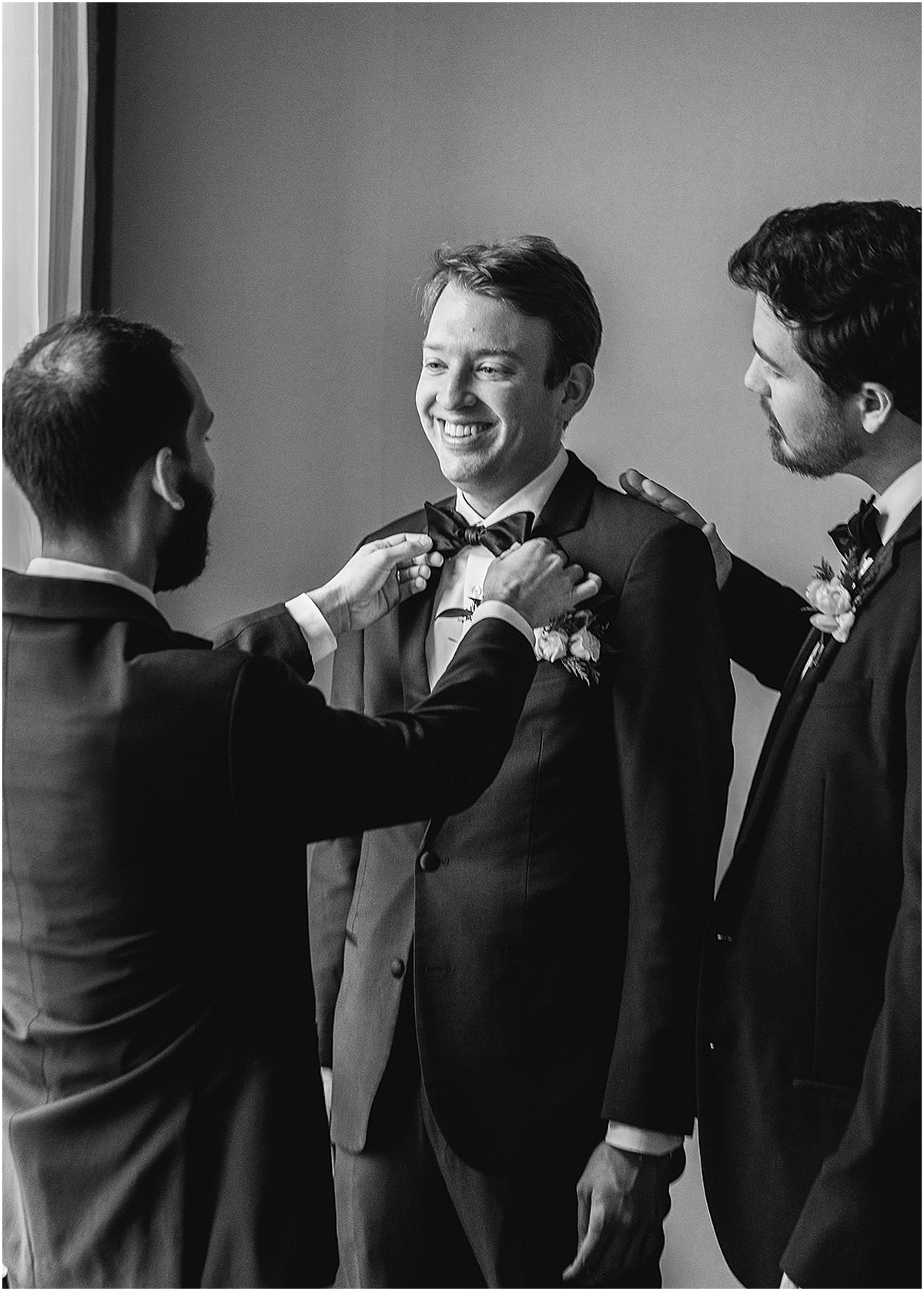 candid getting ready portraits of groom