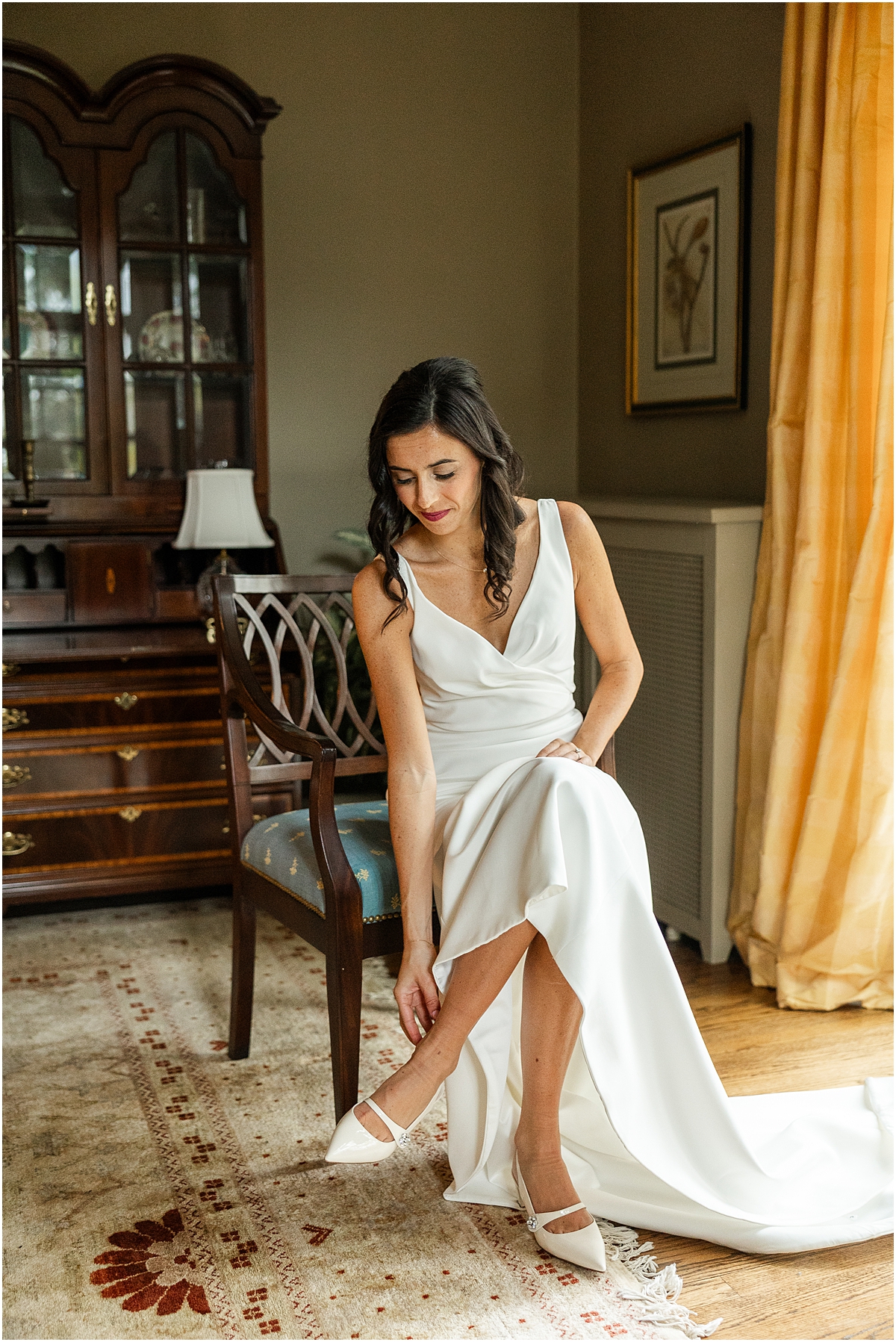 bride puts shoes on before Four Seasons Hotel Chicago Wedding