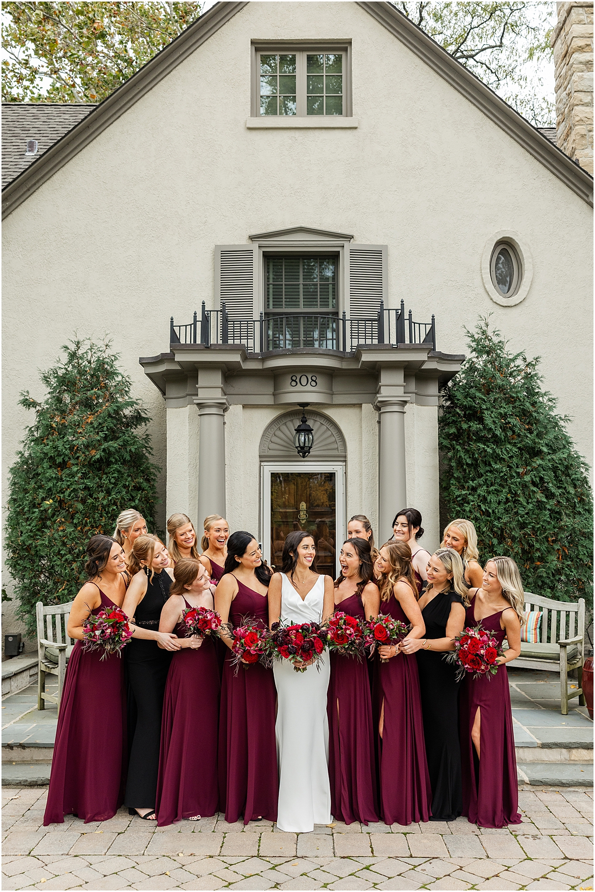 bride with bridesmaids in Burgundy dresses before Four Seasons Hotel Chicago Wedding