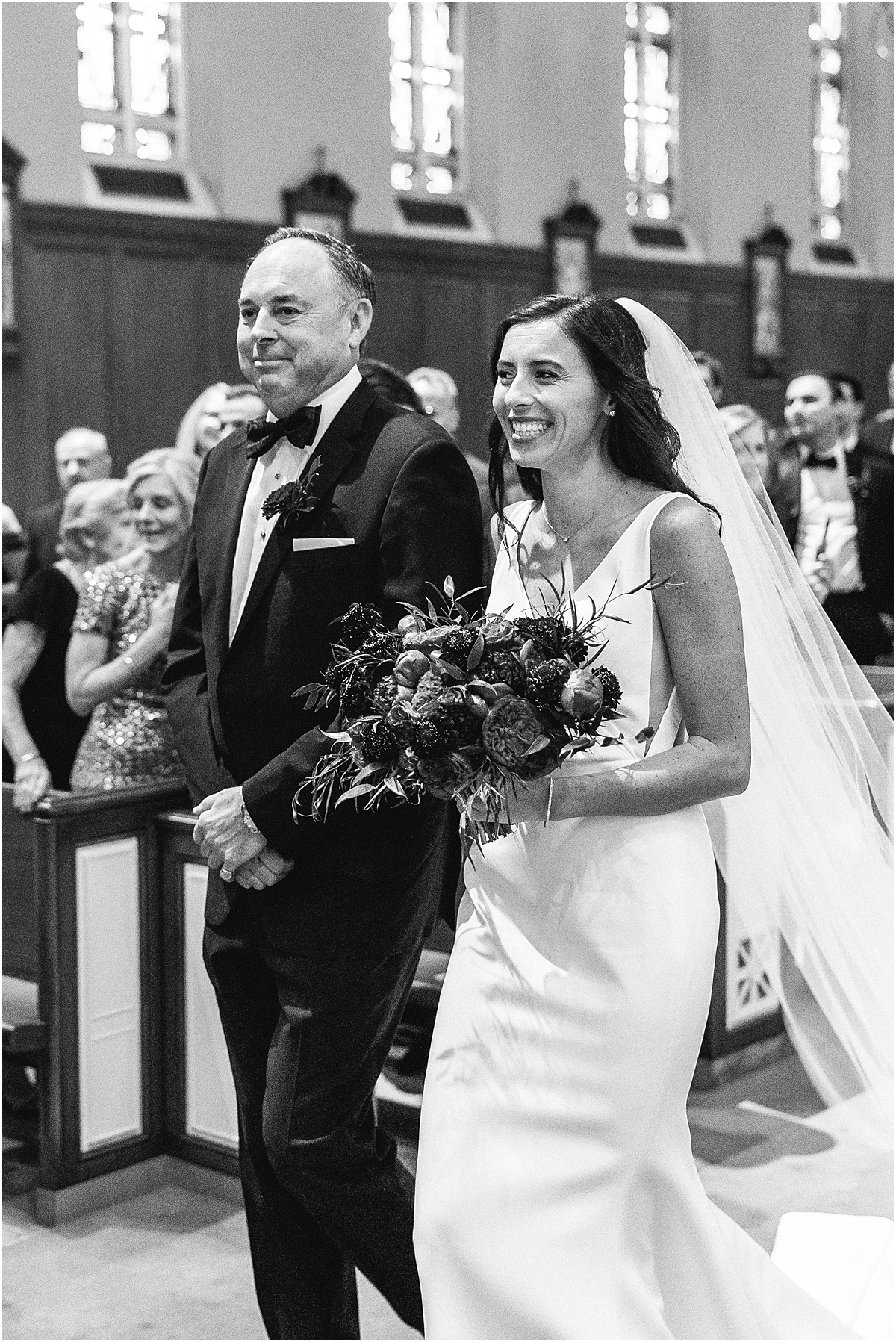 classic portrait of father walking daughter down the aisle 