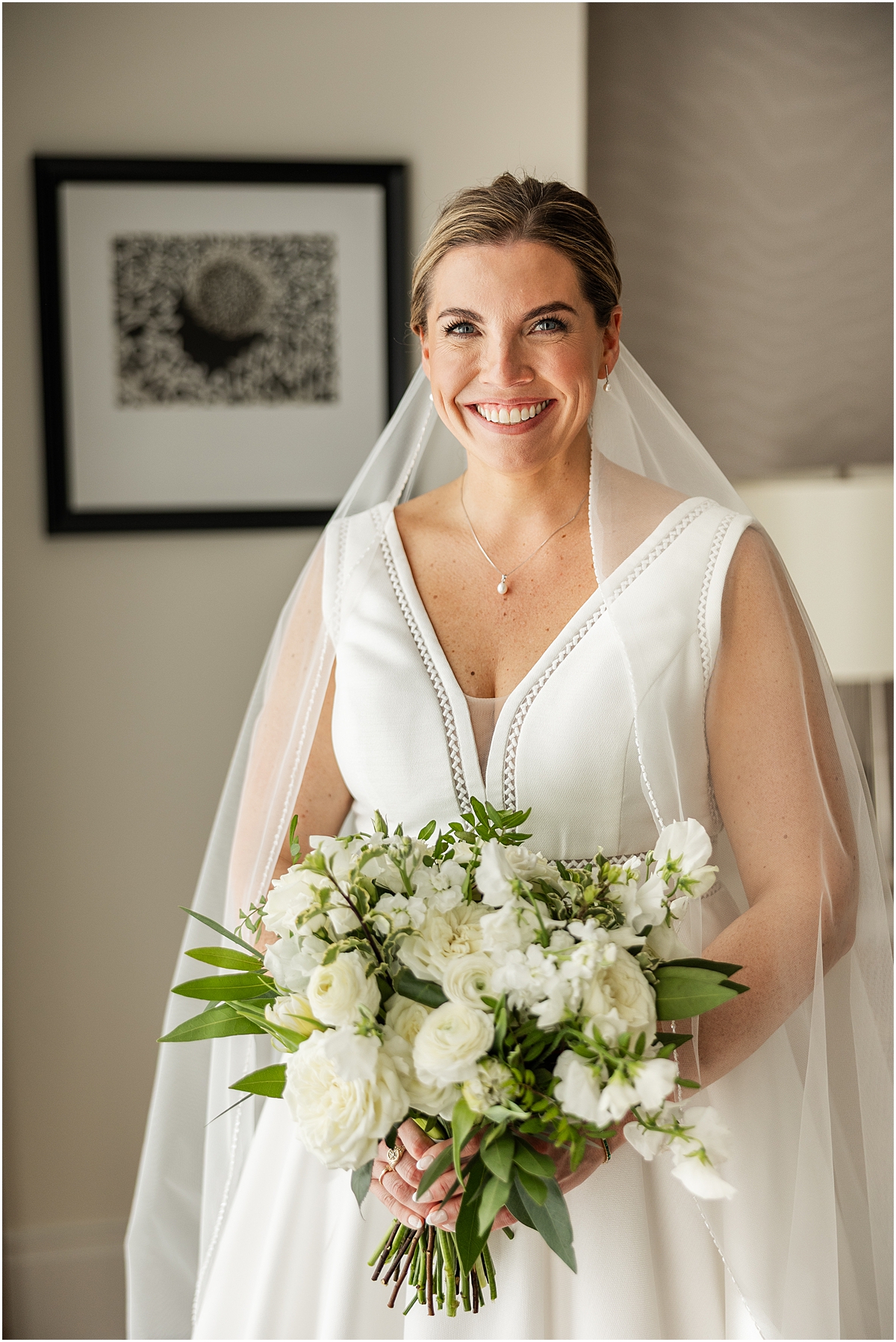 Timeless bride in elegant gown with white flower bouquet