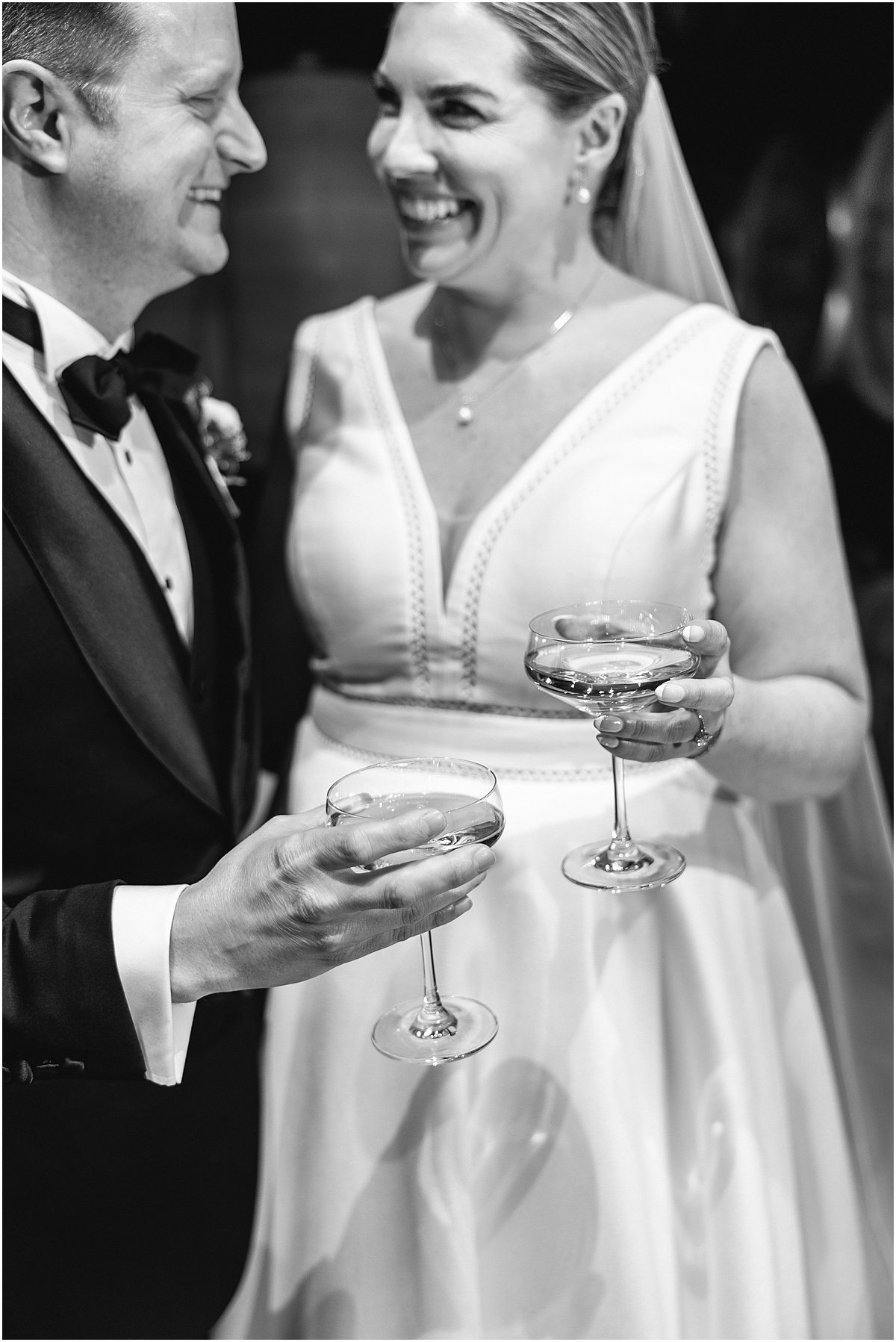 candid bride and groom photos drinking a glass of wine