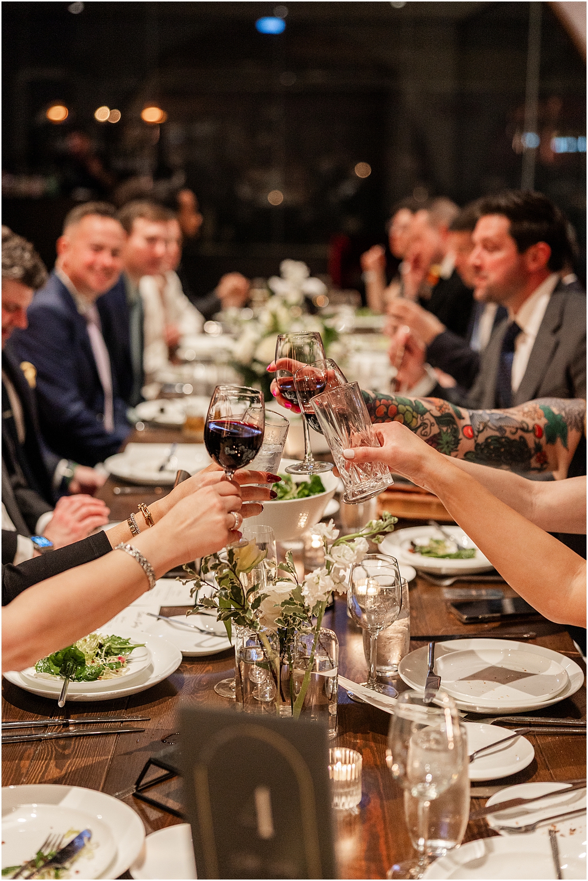 wedding guests toast during reception