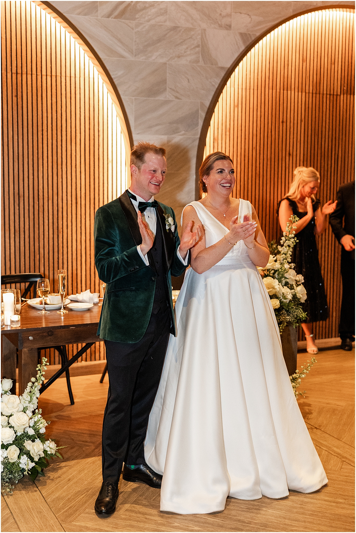 couple claps at reception