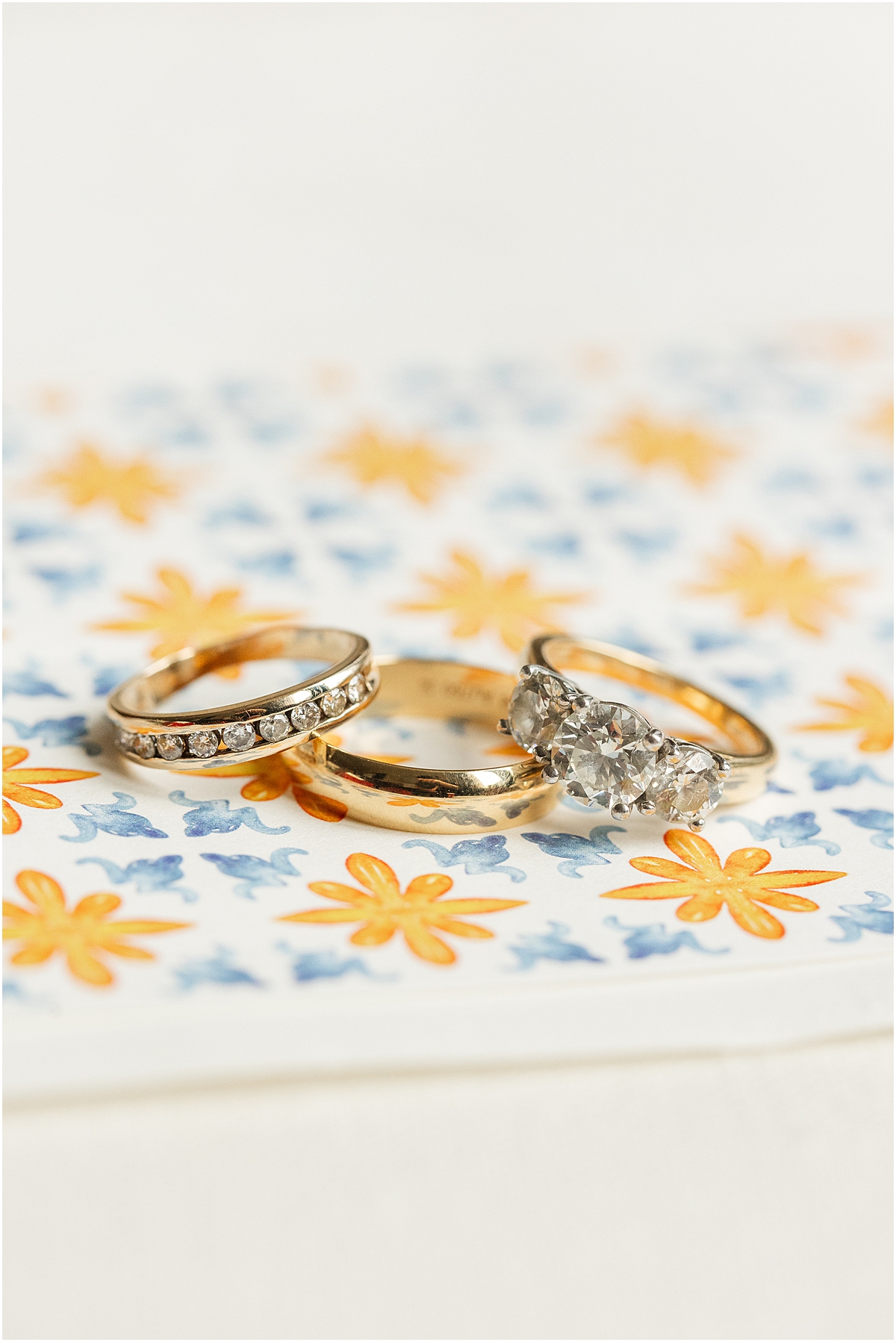 wedding rings on patterned envelope liner