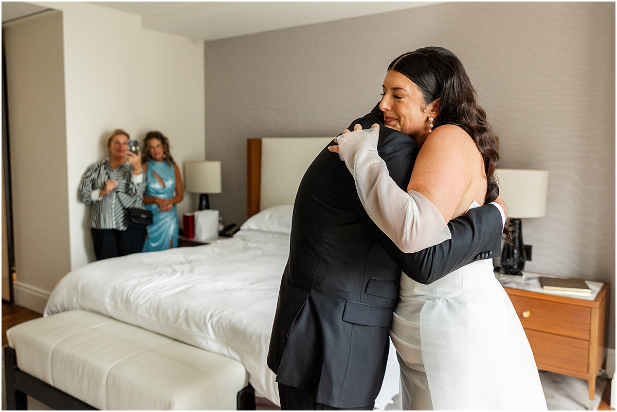 bride hugs father during first look moment