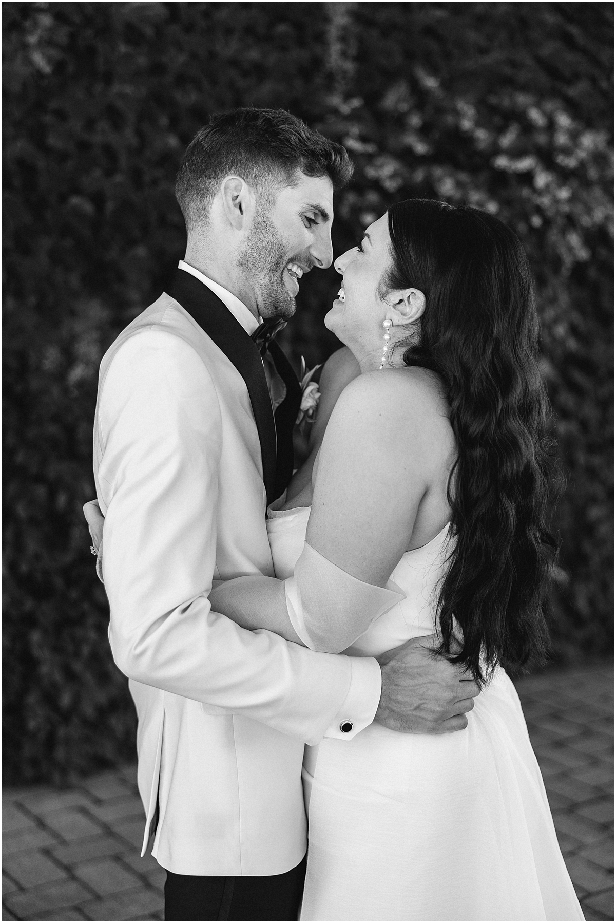 bride and groom look up at each other during candid photos