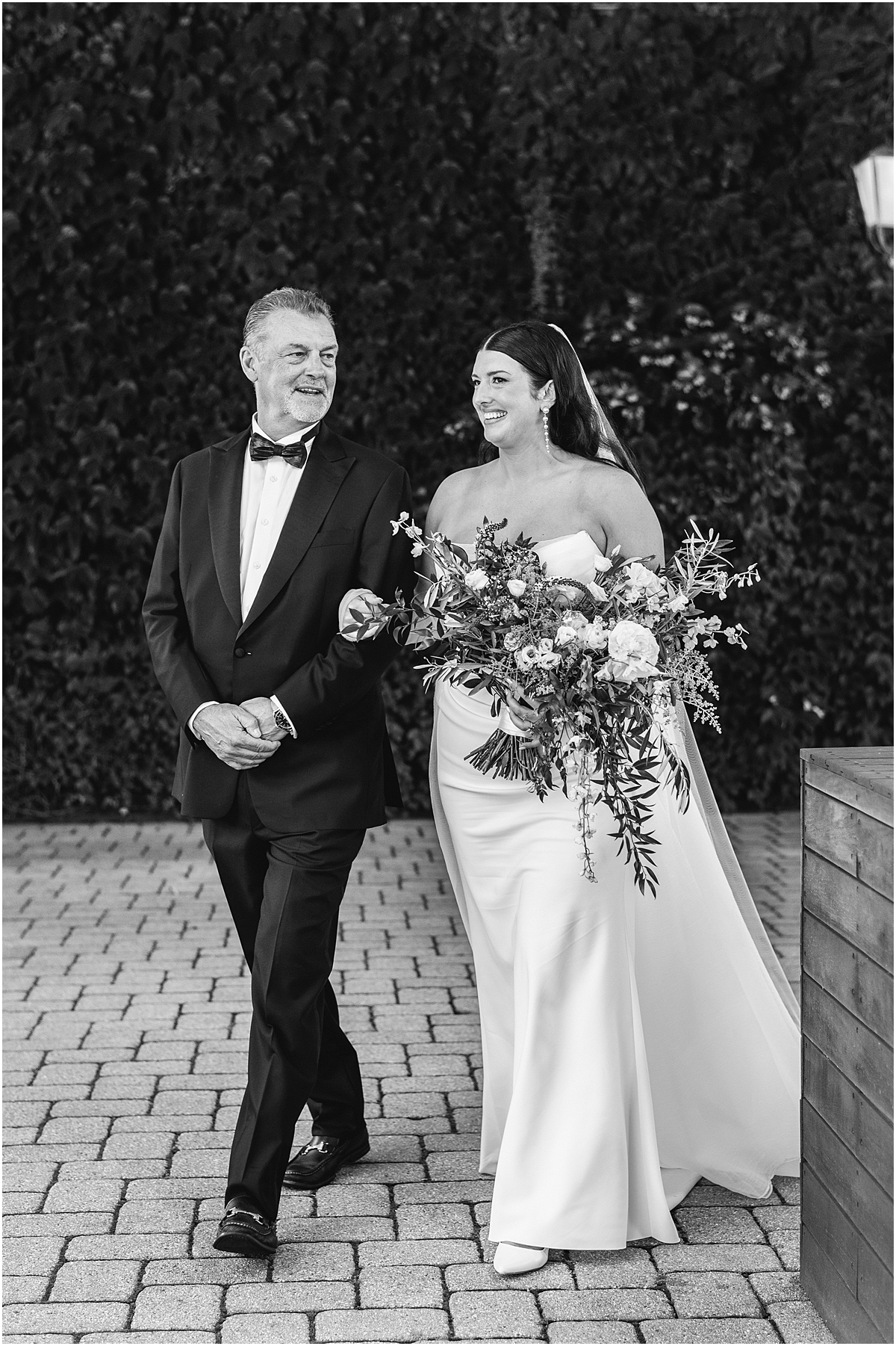 bride walks down aisle with father