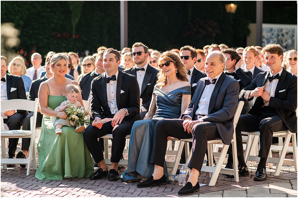 wedding guests during outdoor summer wedding ceremony at Galleria Marchetti